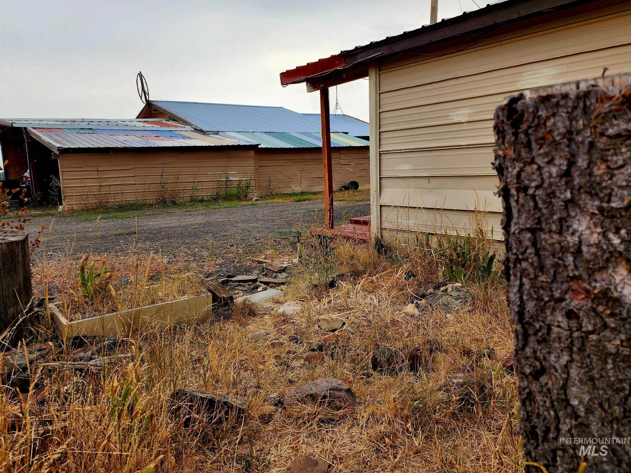 Most of the roofing is metal in assorted colors, creating a unique look, though it could easily be painted if desired