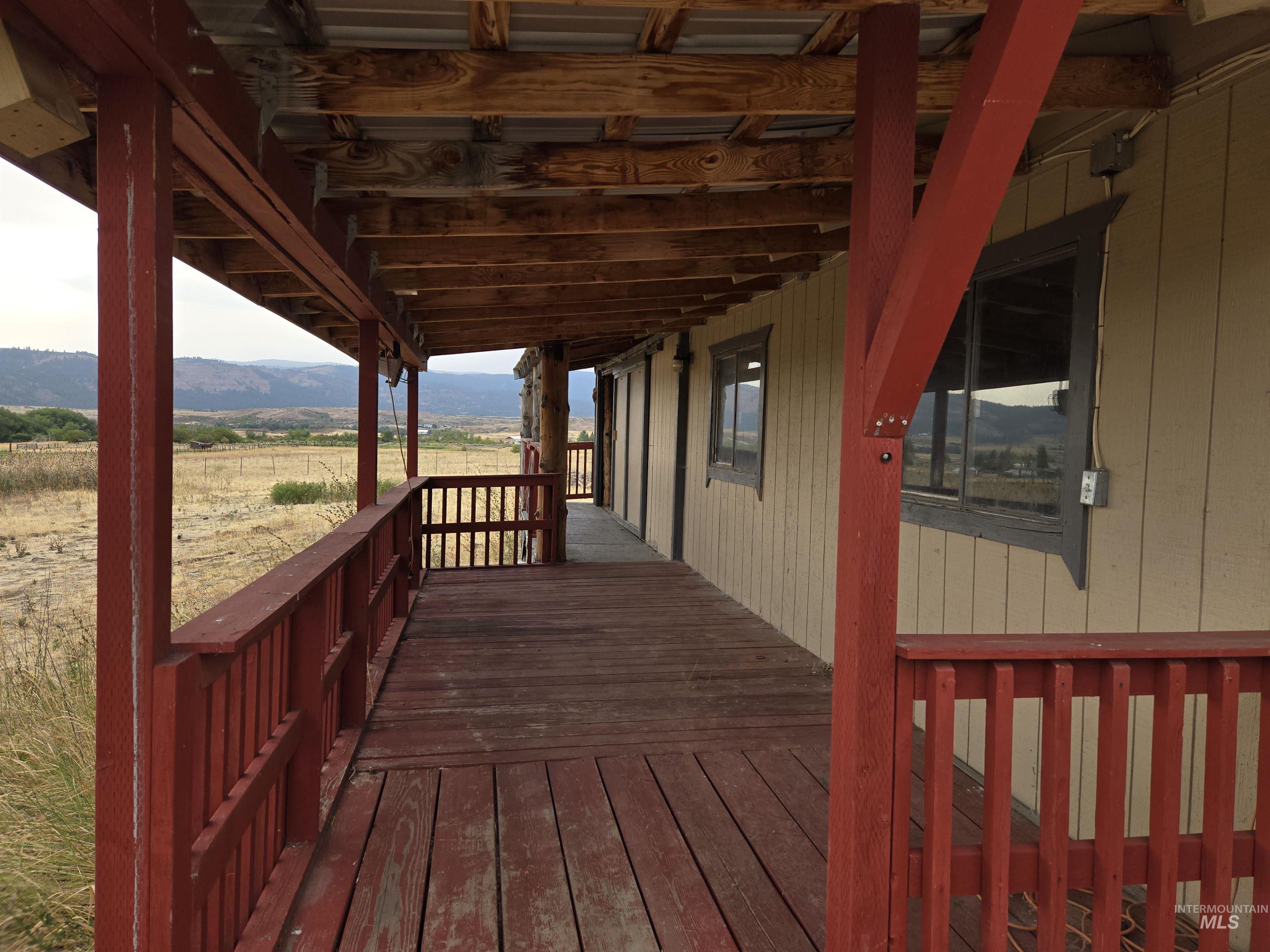 A covered porch provides the perfect spot to take in the mountain view.
