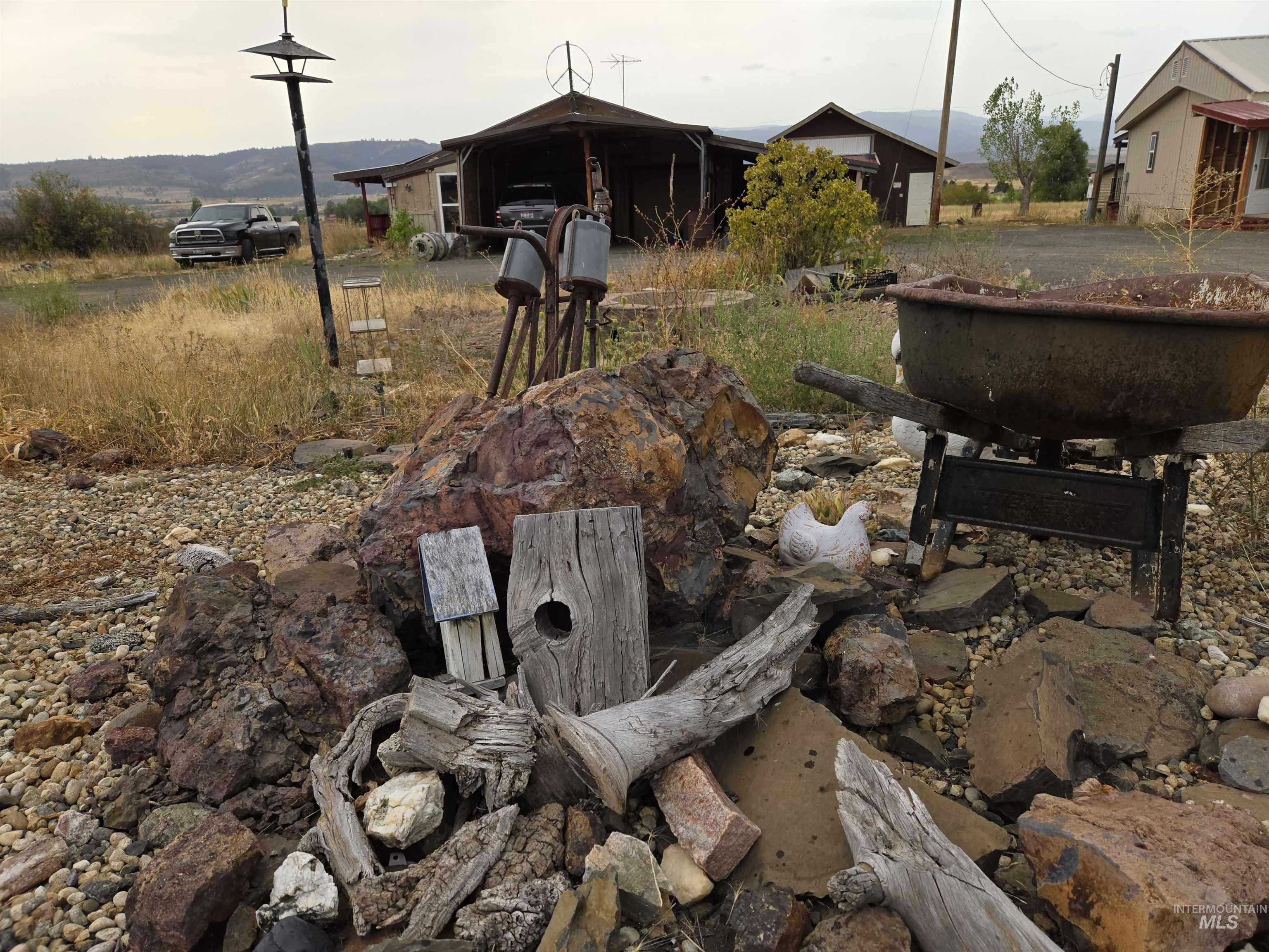 A nicely decorated island in the circle drive features a fire pit for gatherings and relaxation.