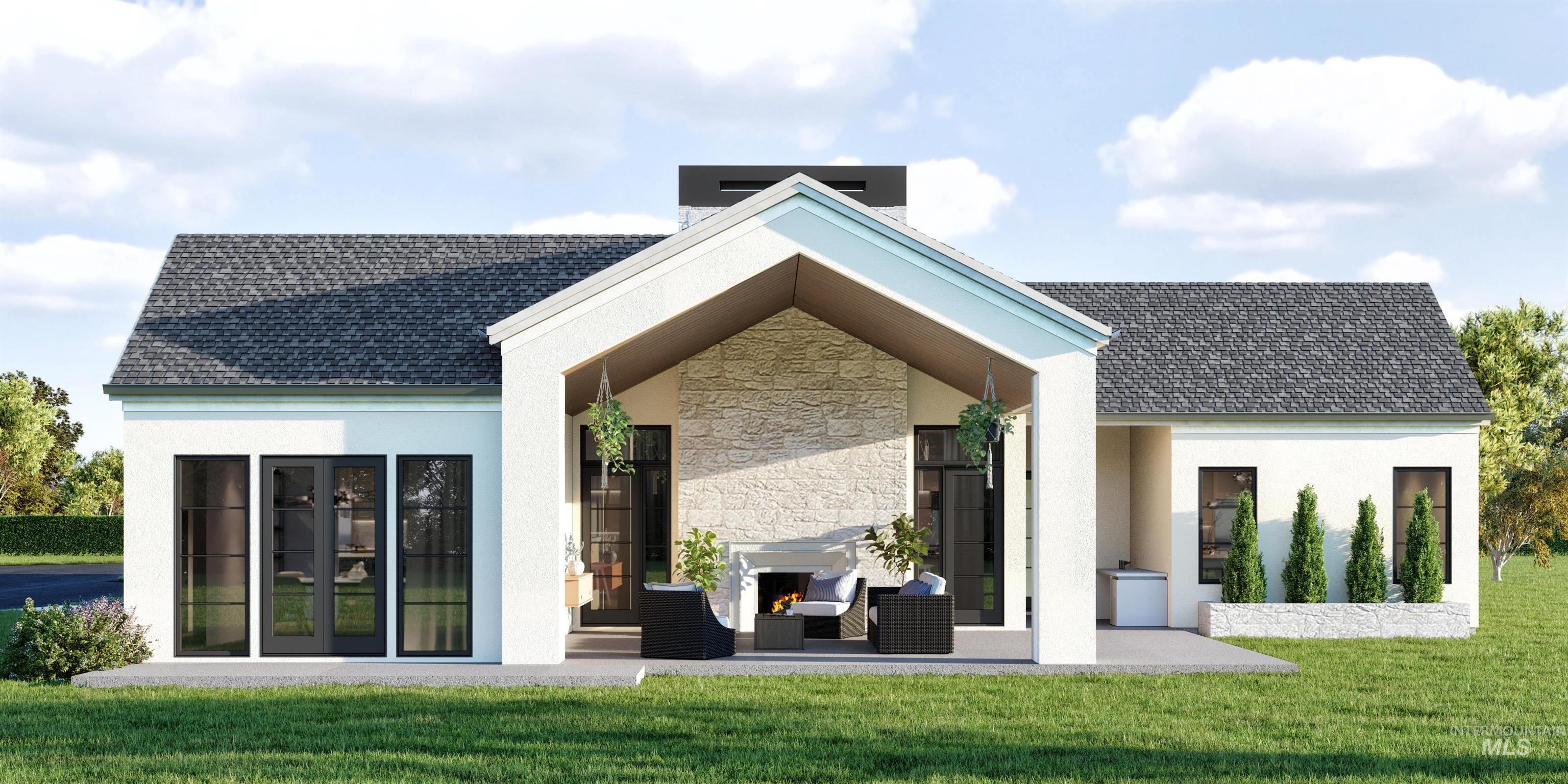 Rear view of house featuring stone siding, a lawn, stucco siding, and roof with shingles