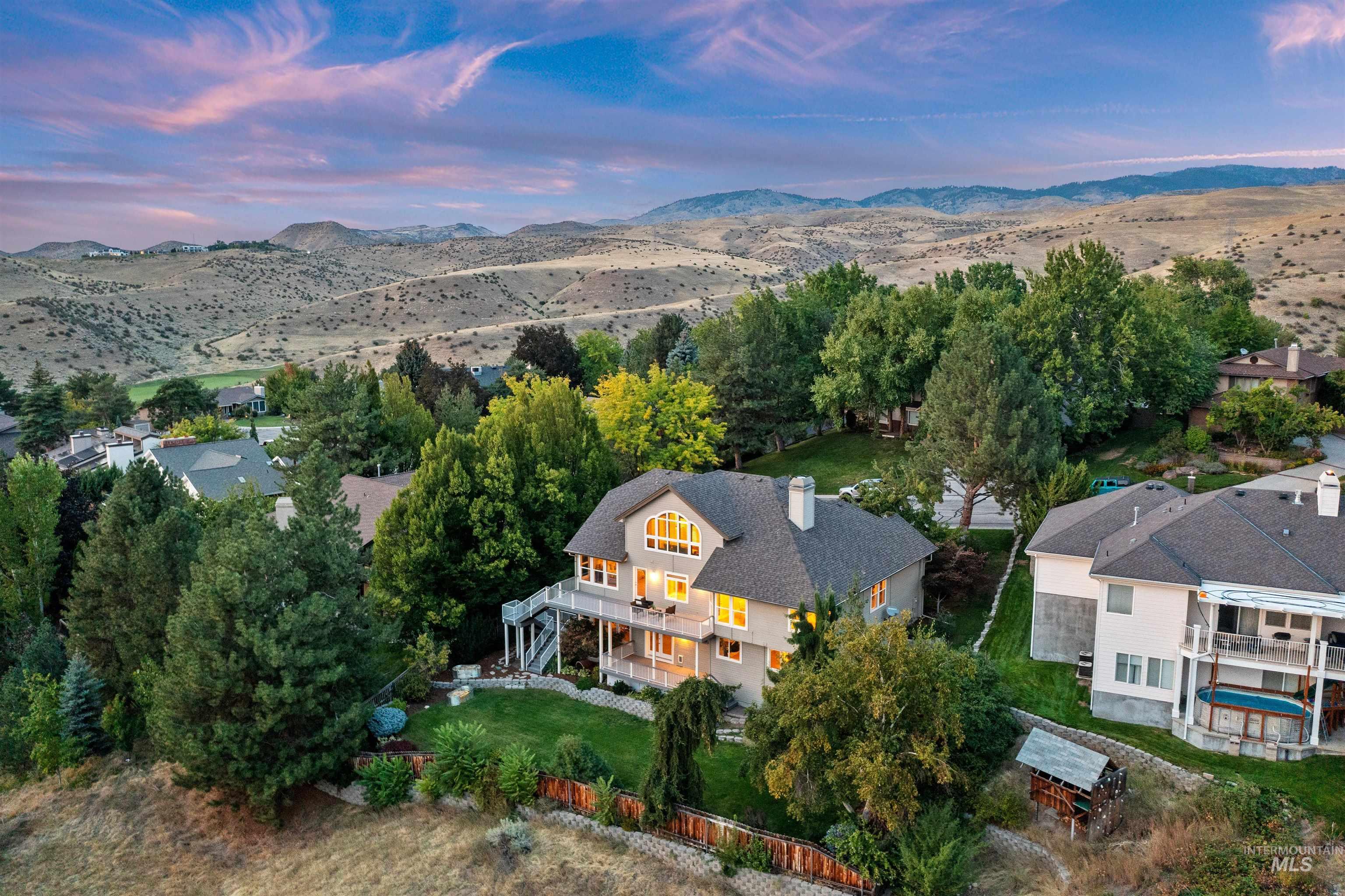 View of subject property with a mountain backdrop