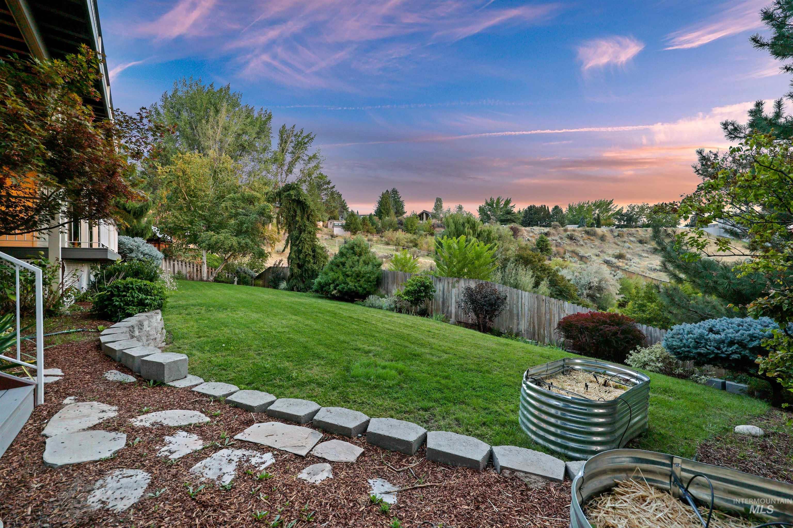 Fenced backyard with a patio area
