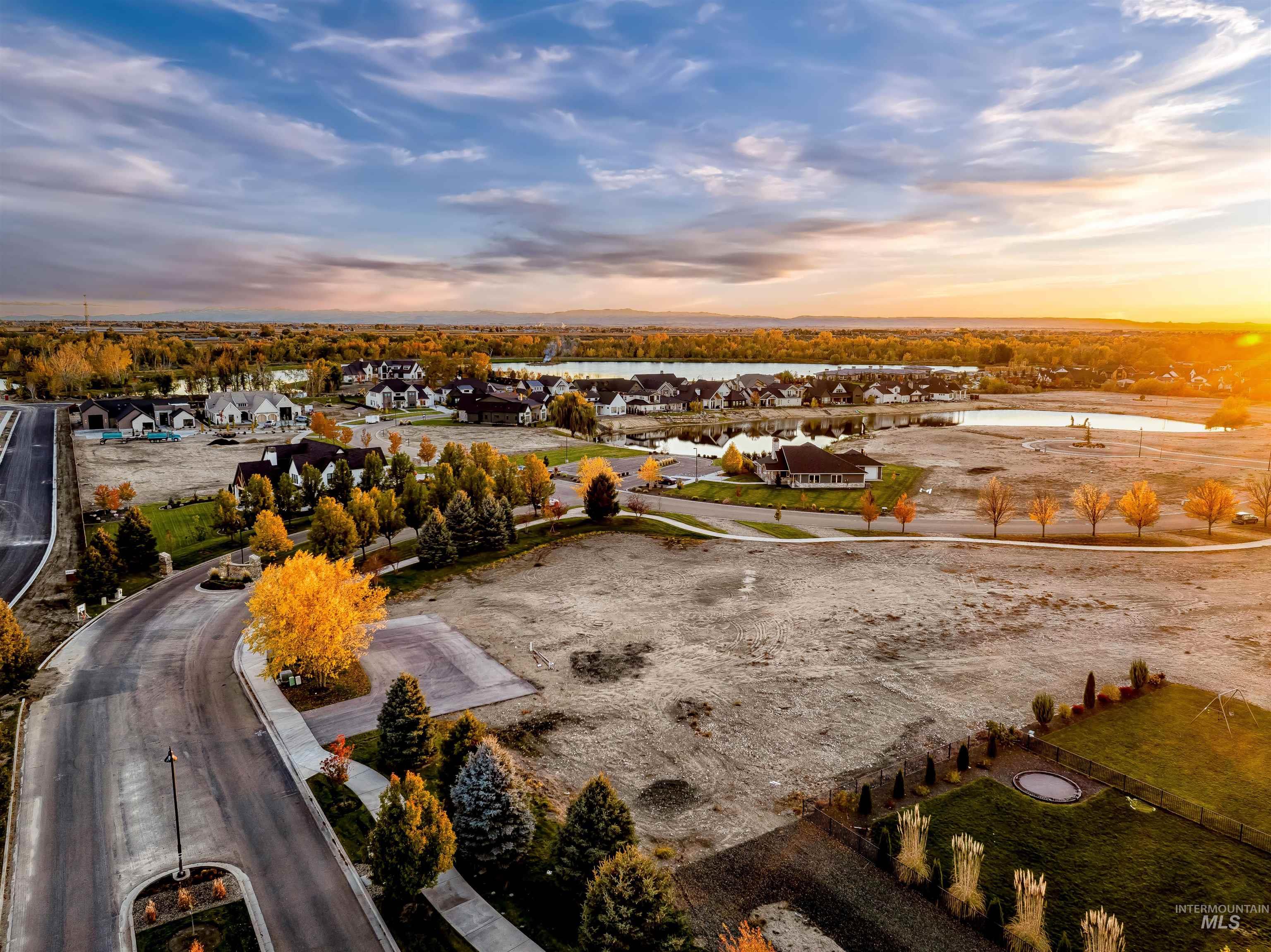 Aerial perspective of suburban area with a nearby body of water