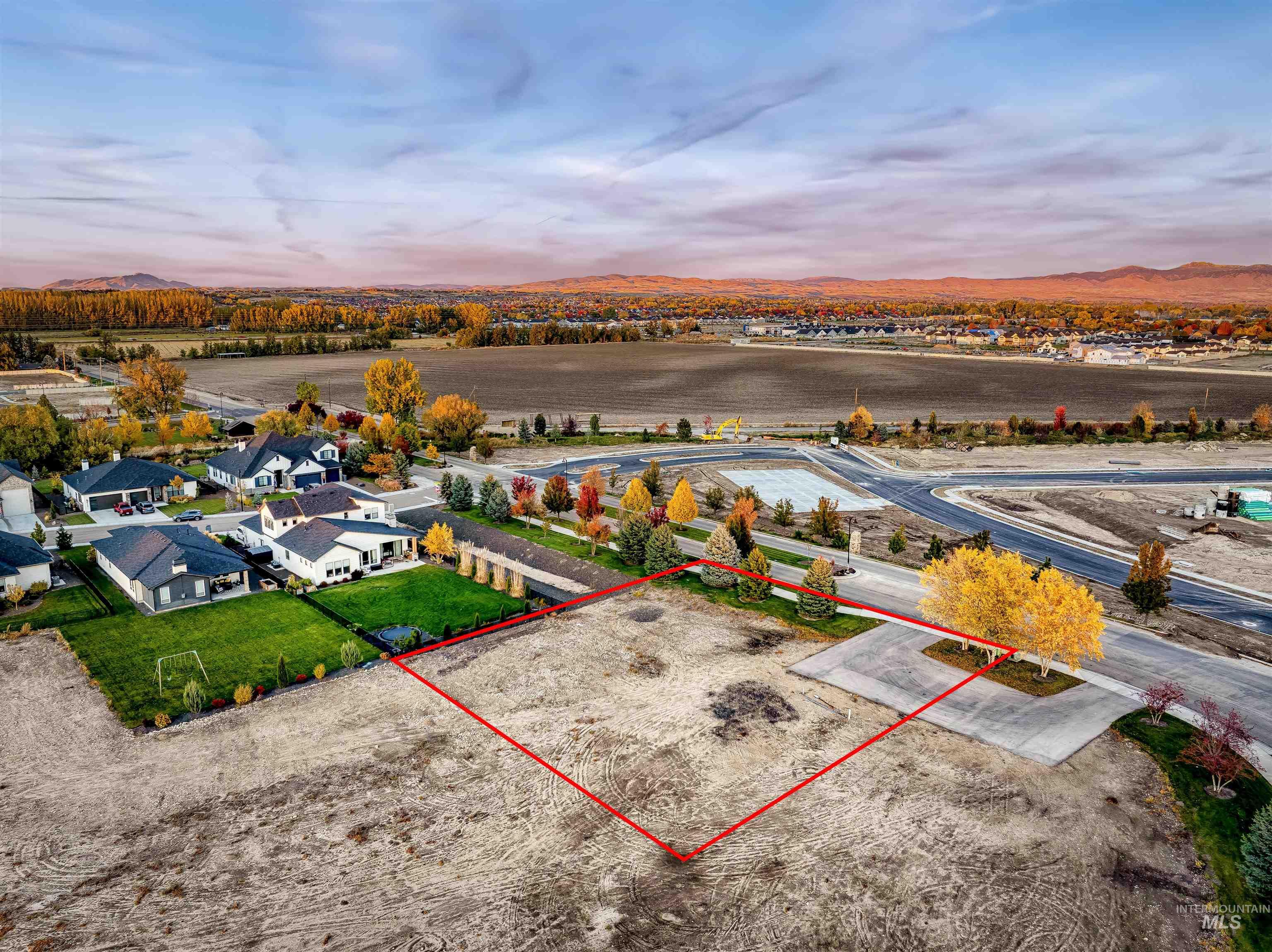 Aerial view of residential area with property boundaries highlighted