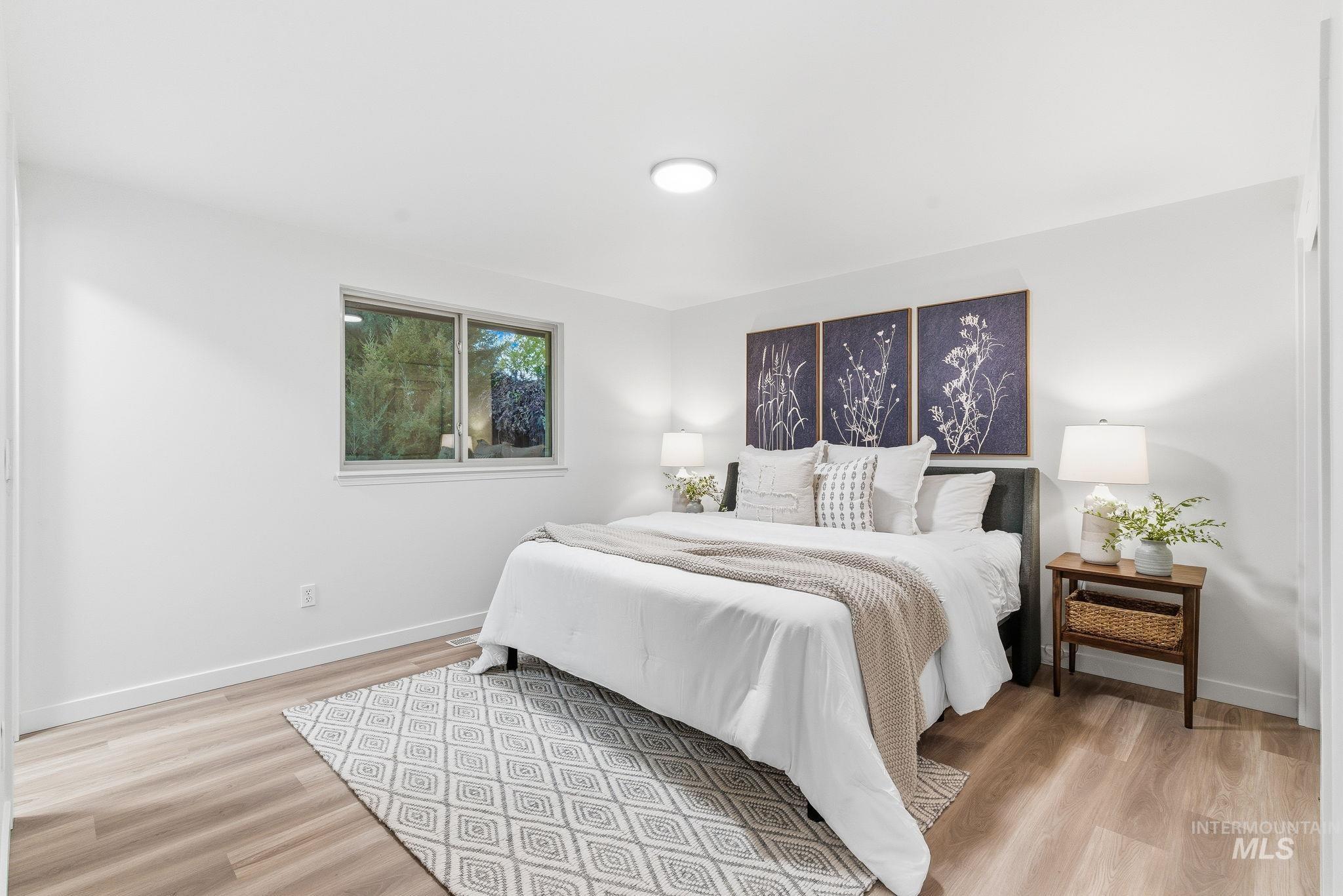 Bedroom with light wood-style floors