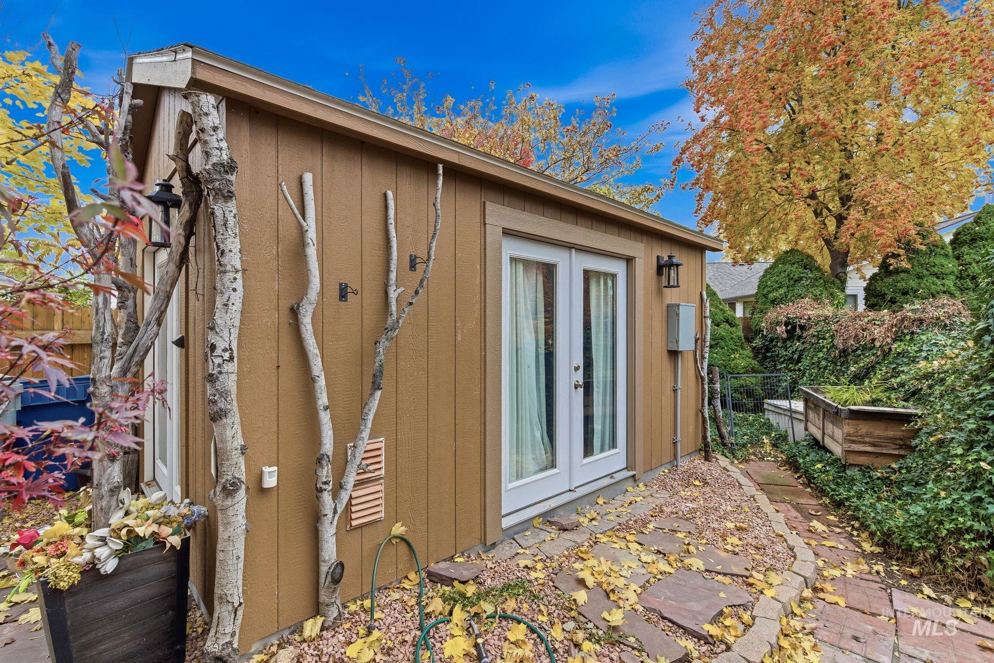 View of side of home with french doors and a patio