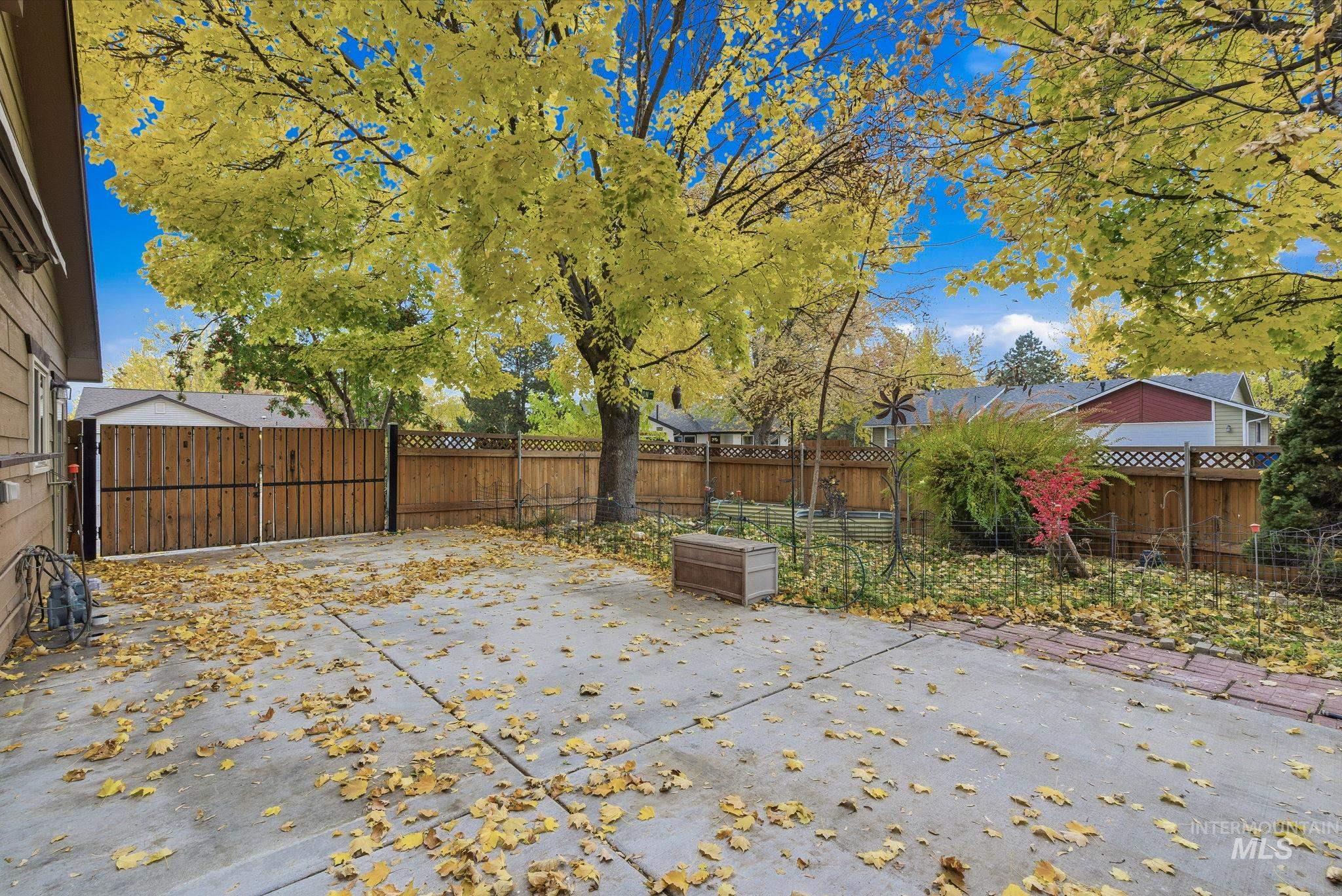 Fenced backyard featuring a patio