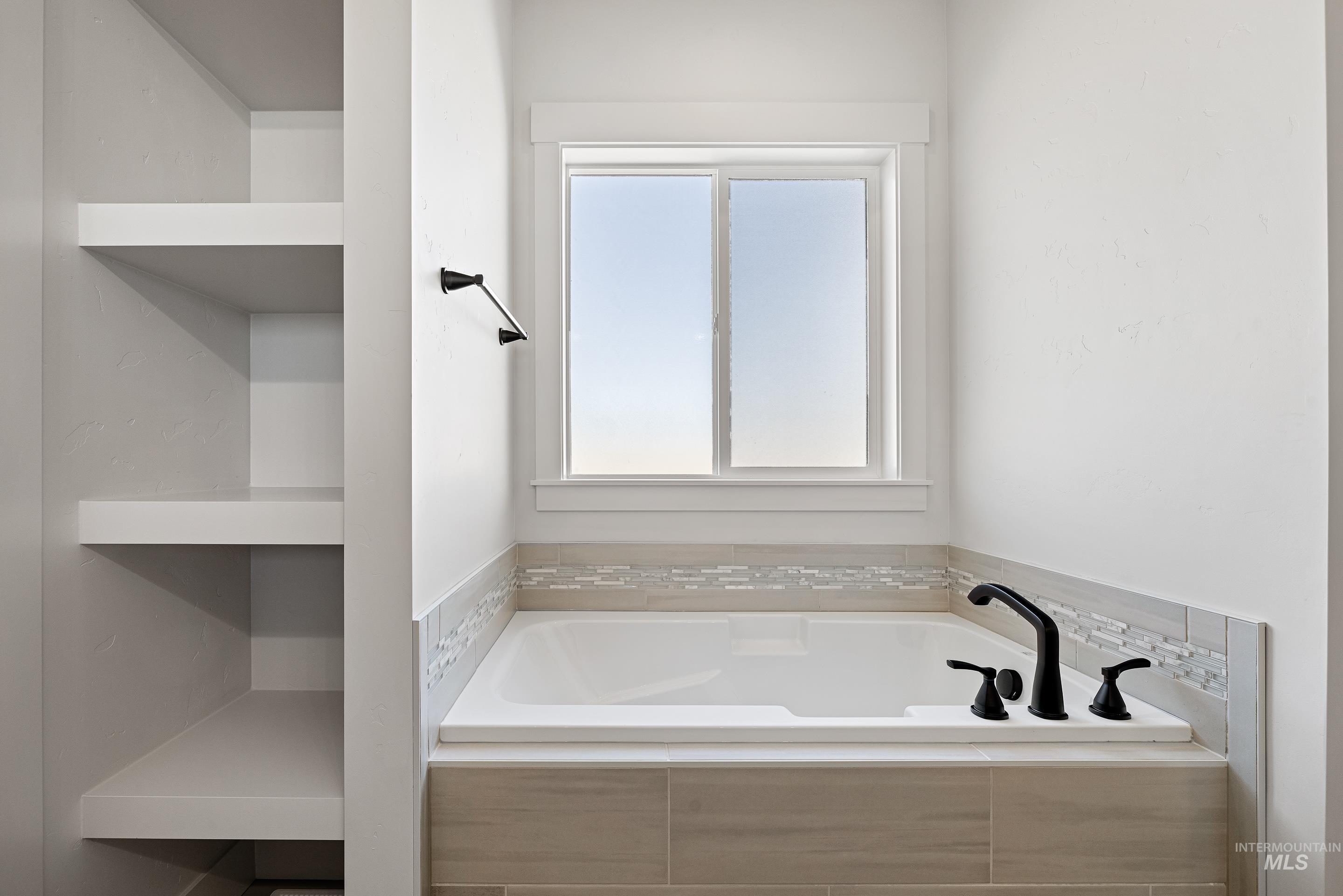 Full bathroom with a bath