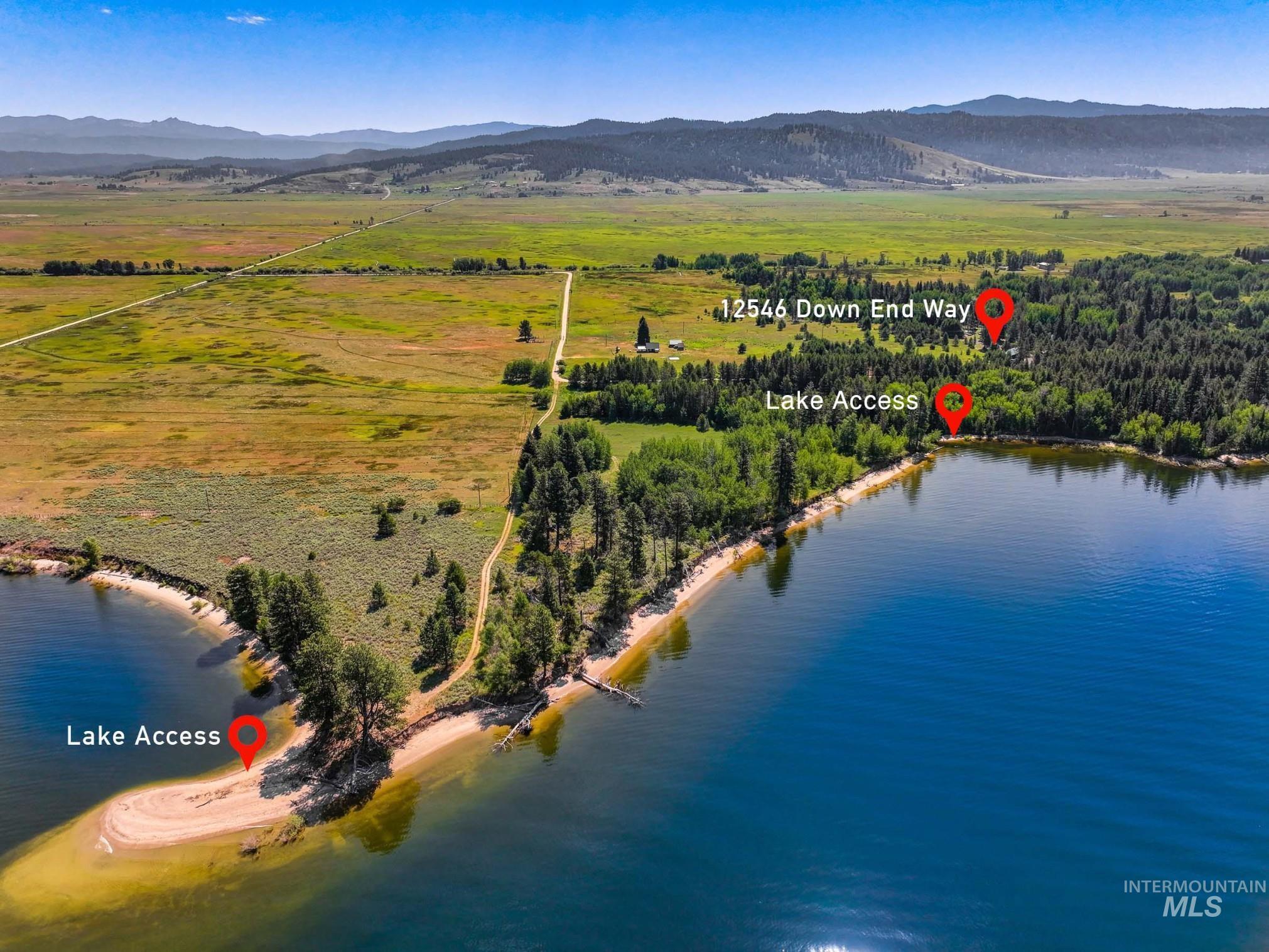 Drone / aerial view of a water and mountain view showing lake access points.
