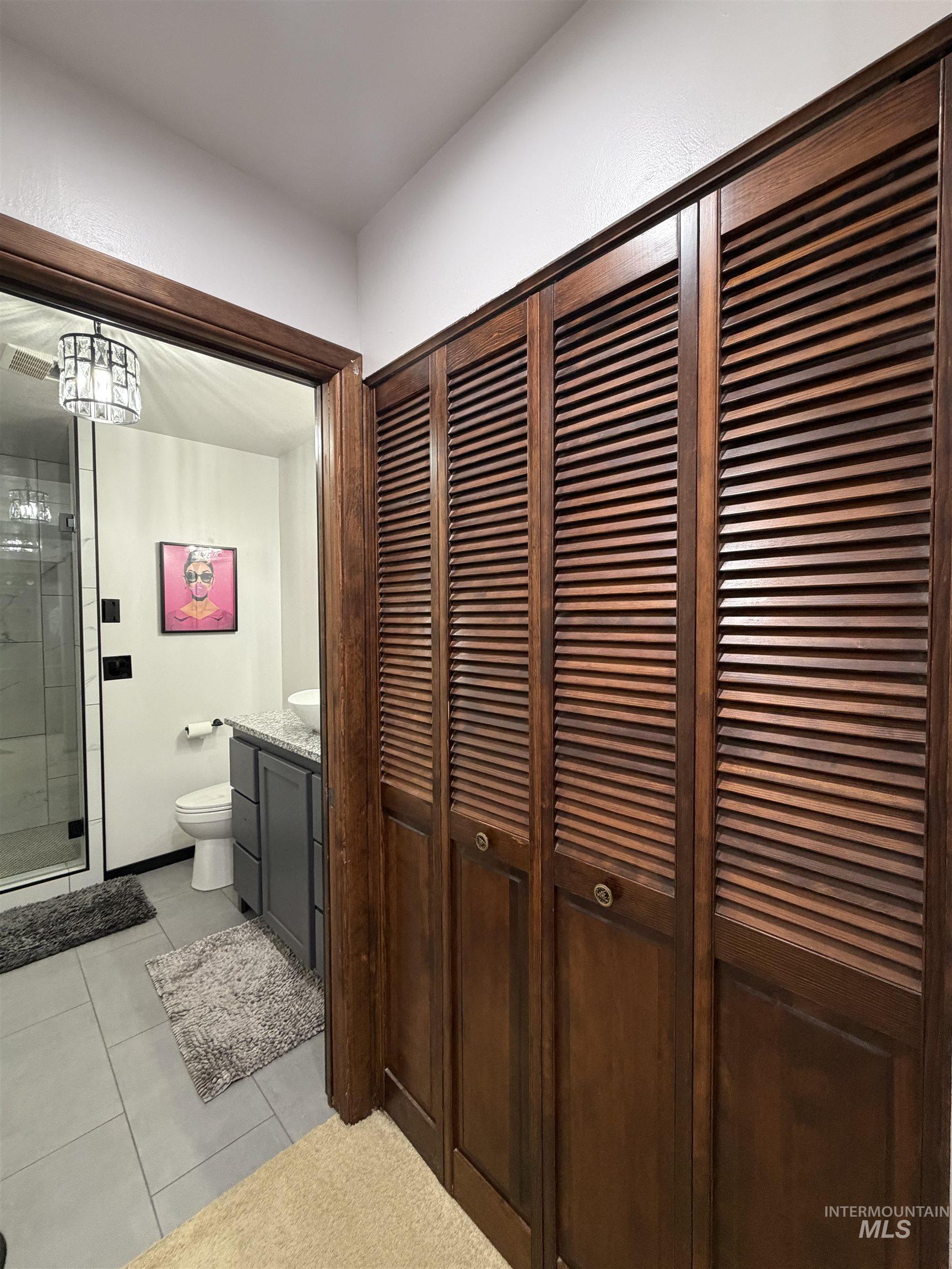 Rich wood-finish louvered bi-fold doors