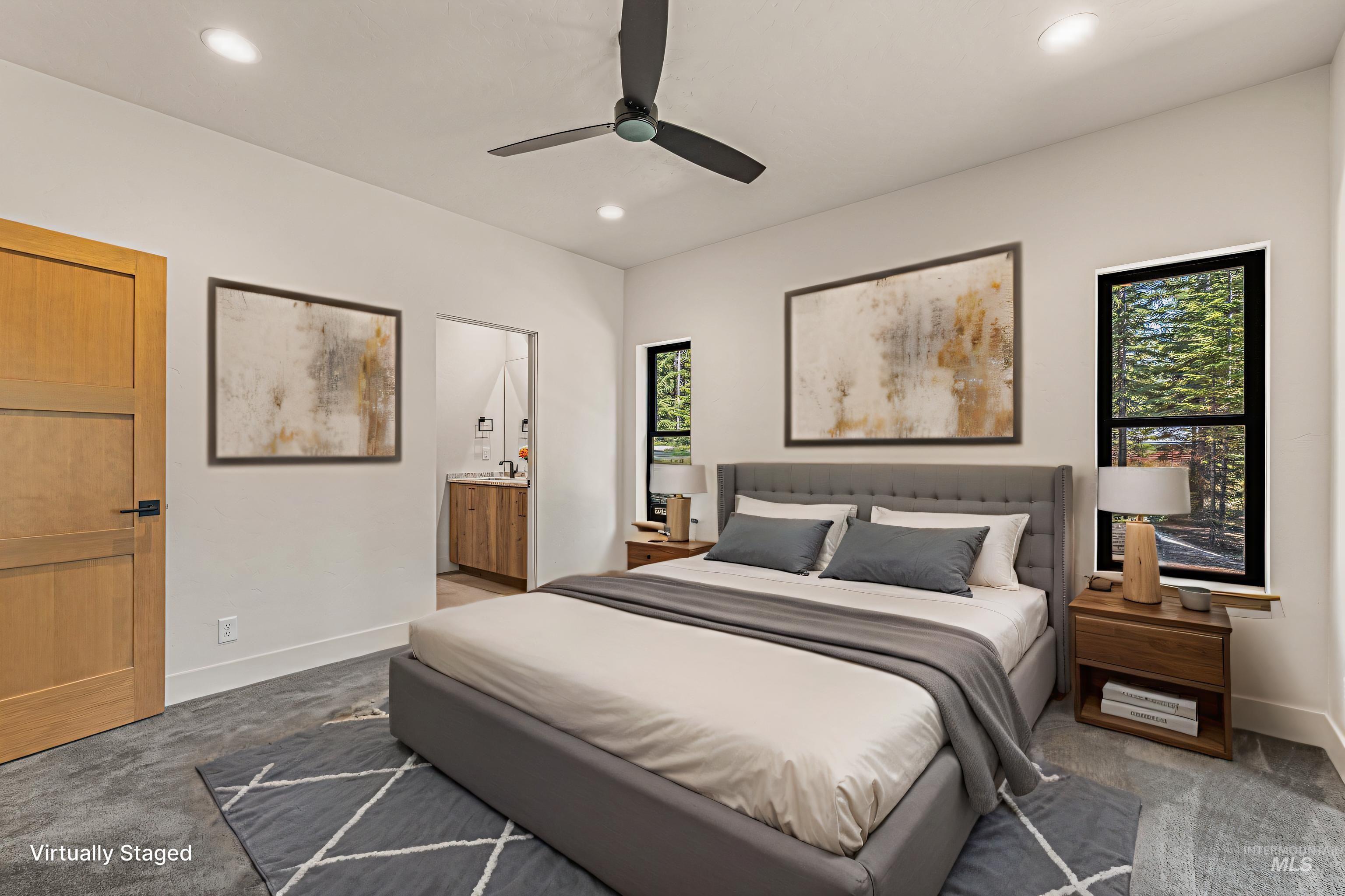 Carpeted bedroom with ceiling fan, ensuite bathroom, and recessed lighting