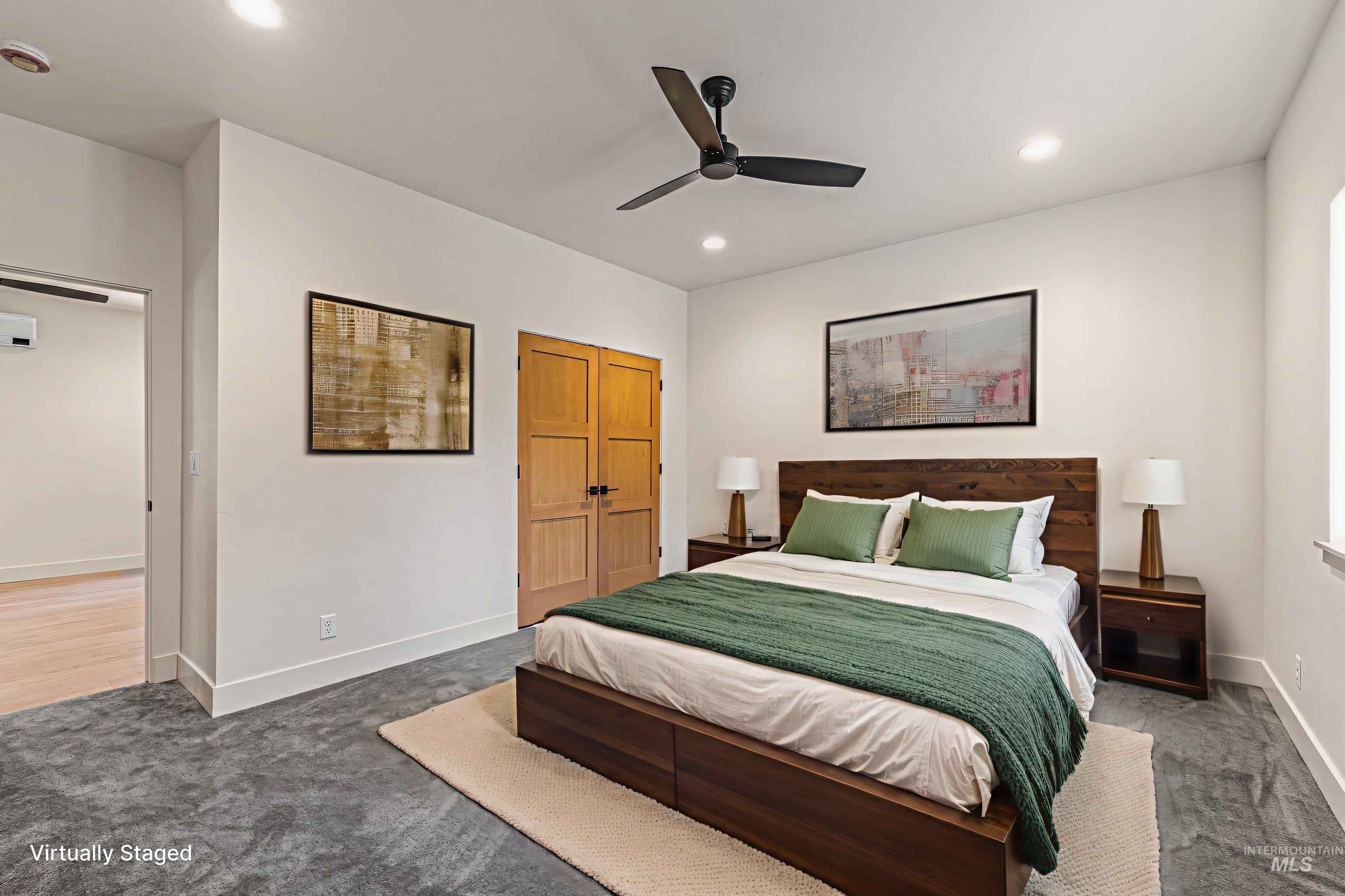 Carpeted bedroom featuring ceiling fan, a closet, and recessed lighting