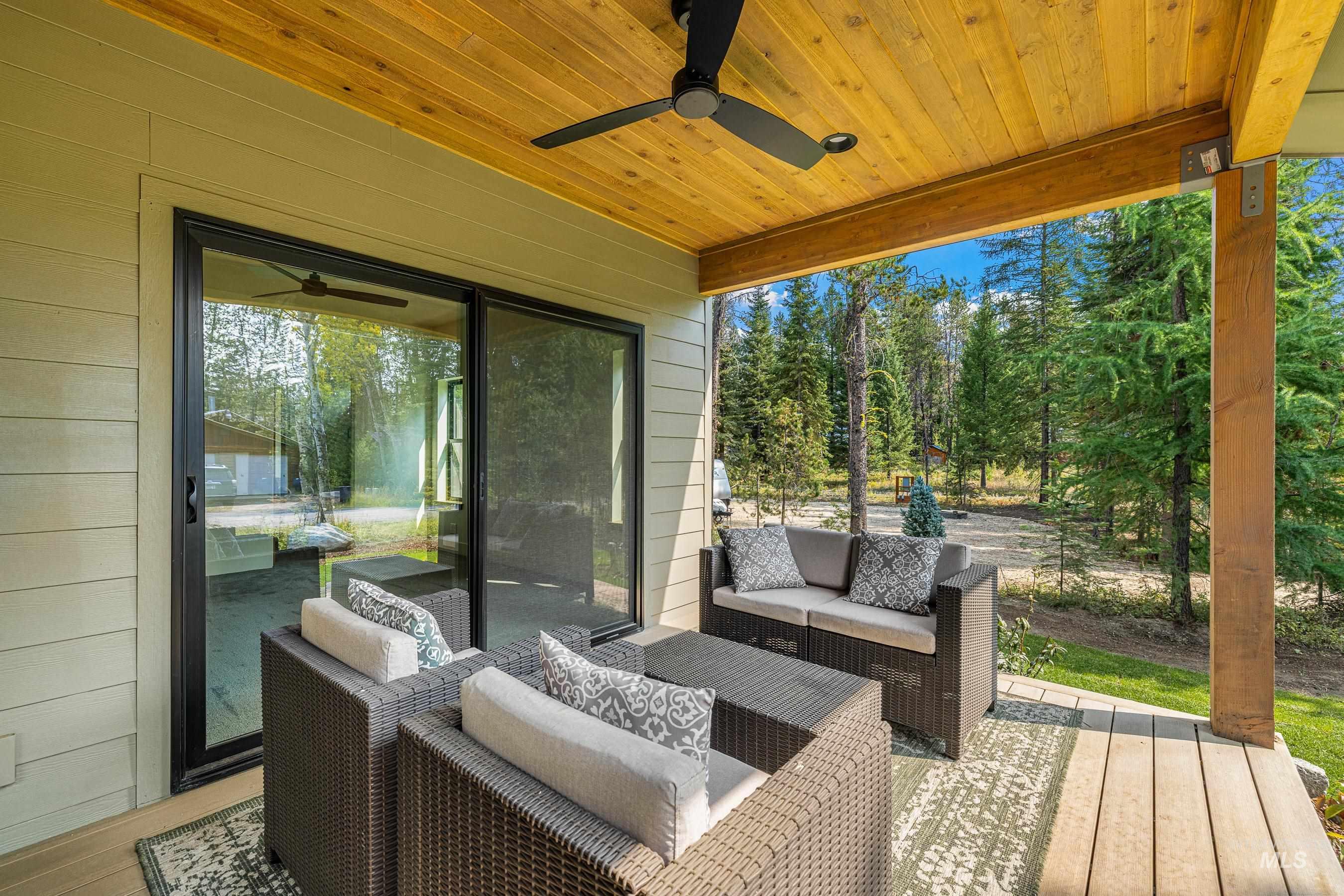 Deck featuring a ceiling fan, an outdoor lounge area, and a patio