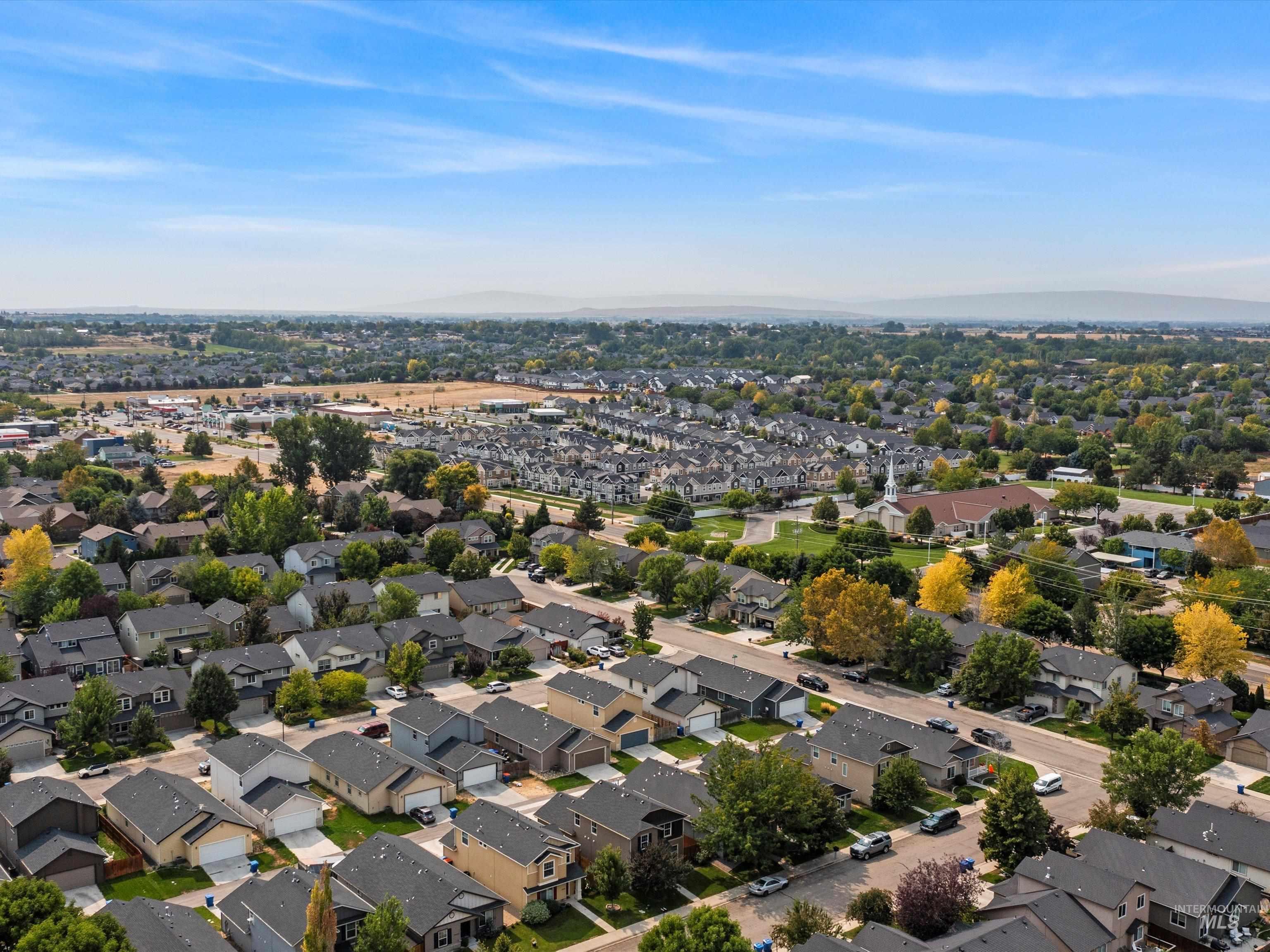Aerial view of residential area with a mountainous background