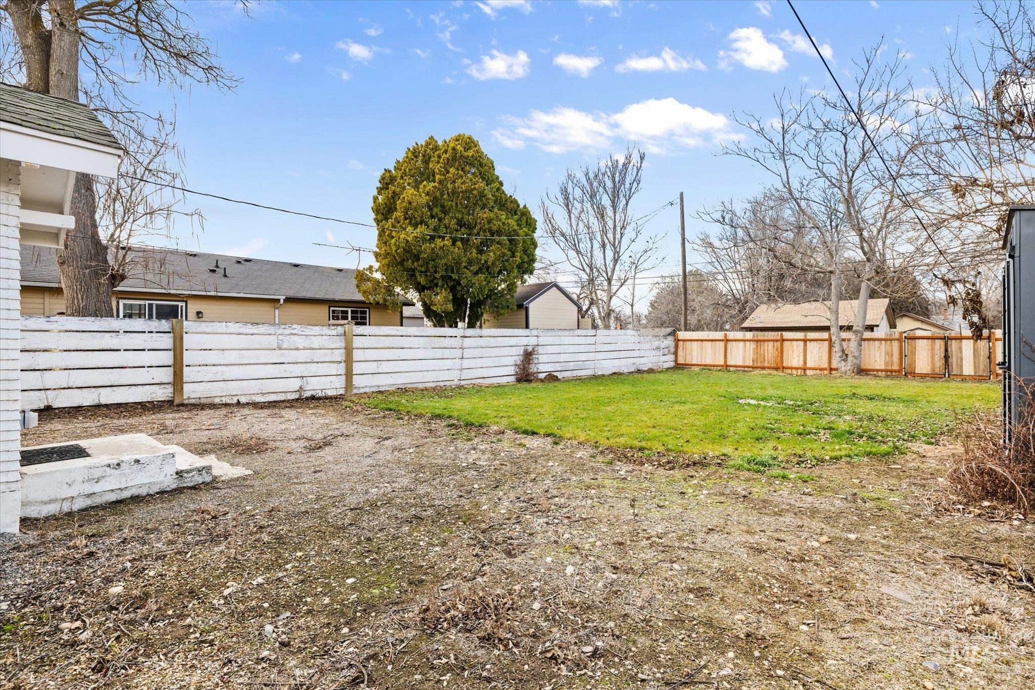 View of fenced backyard