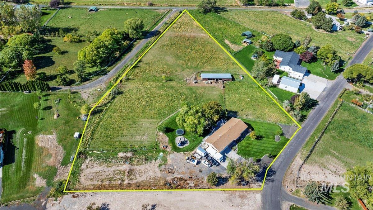 Aerial view of property's location with property boundaries highlighted and rural landscape