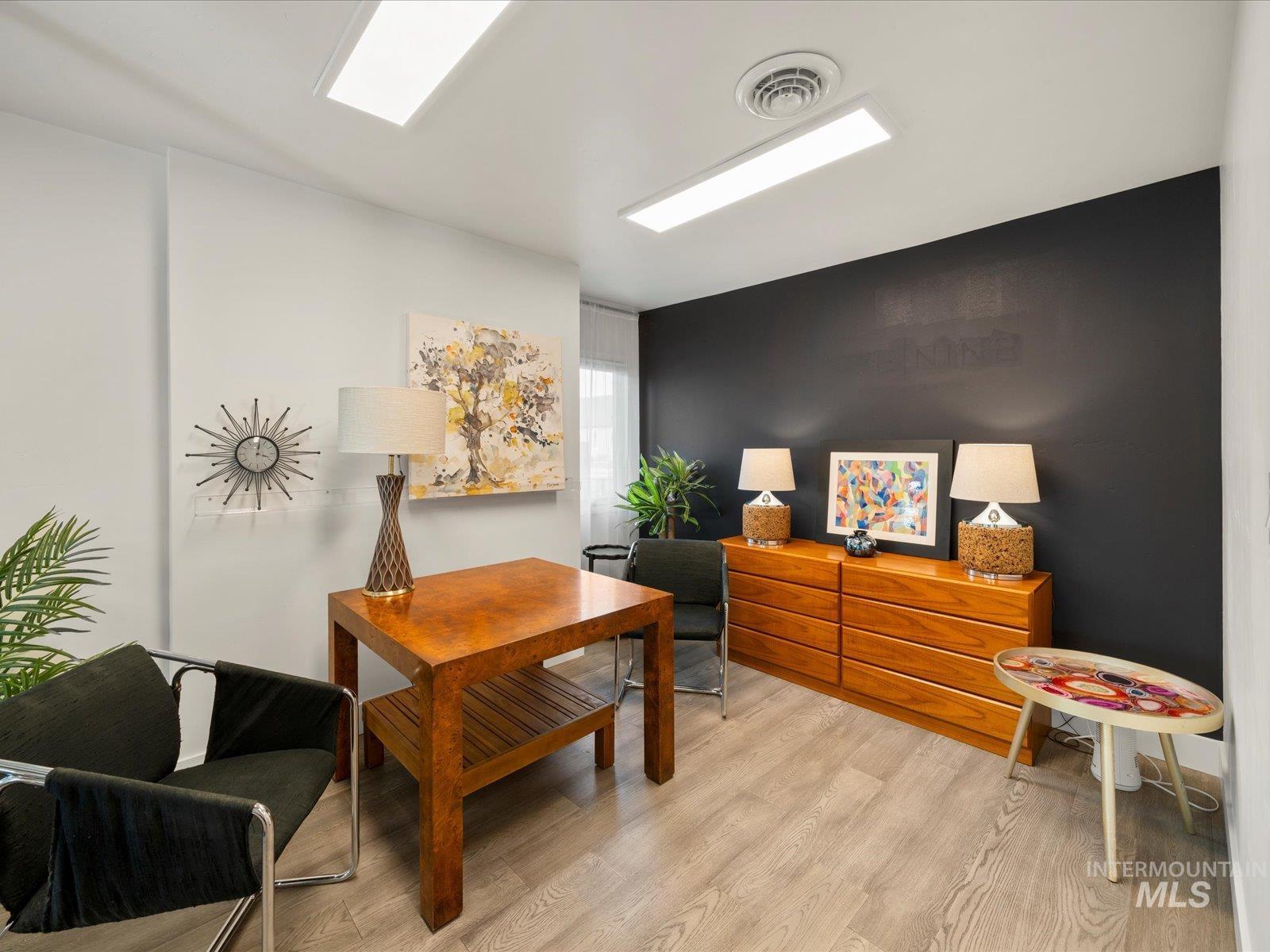 Office area featuring wood finished floors
