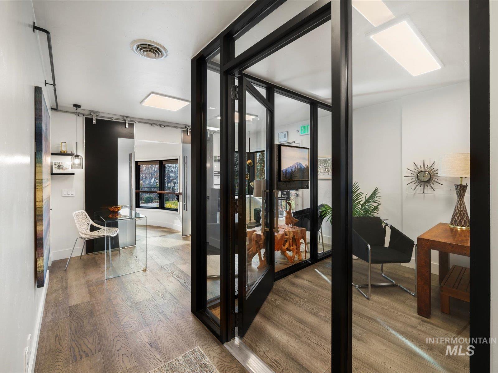 Doorway to outside featuring wood finished floors