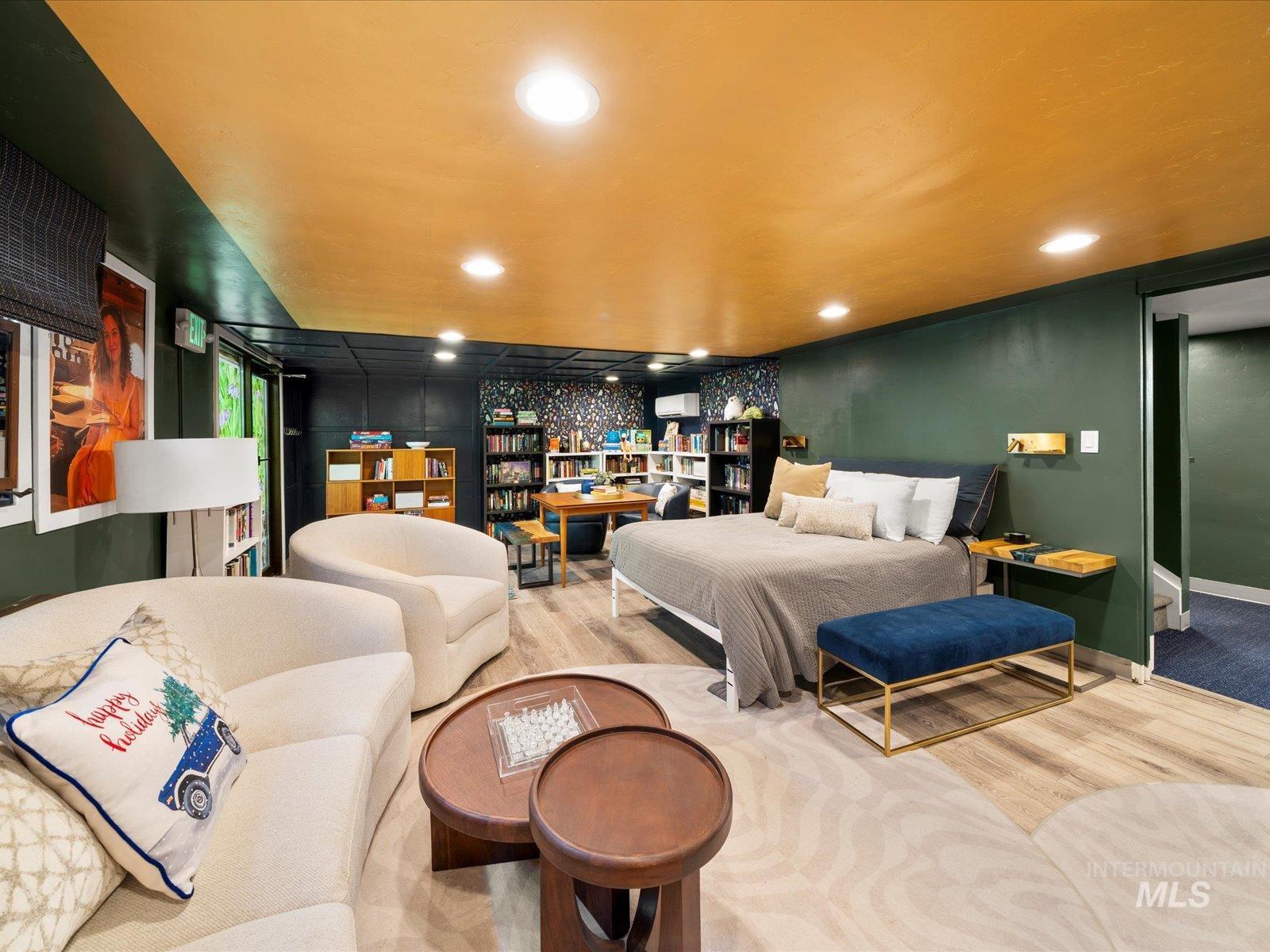 Bedroom featuring wood finished floors and recessed lighting