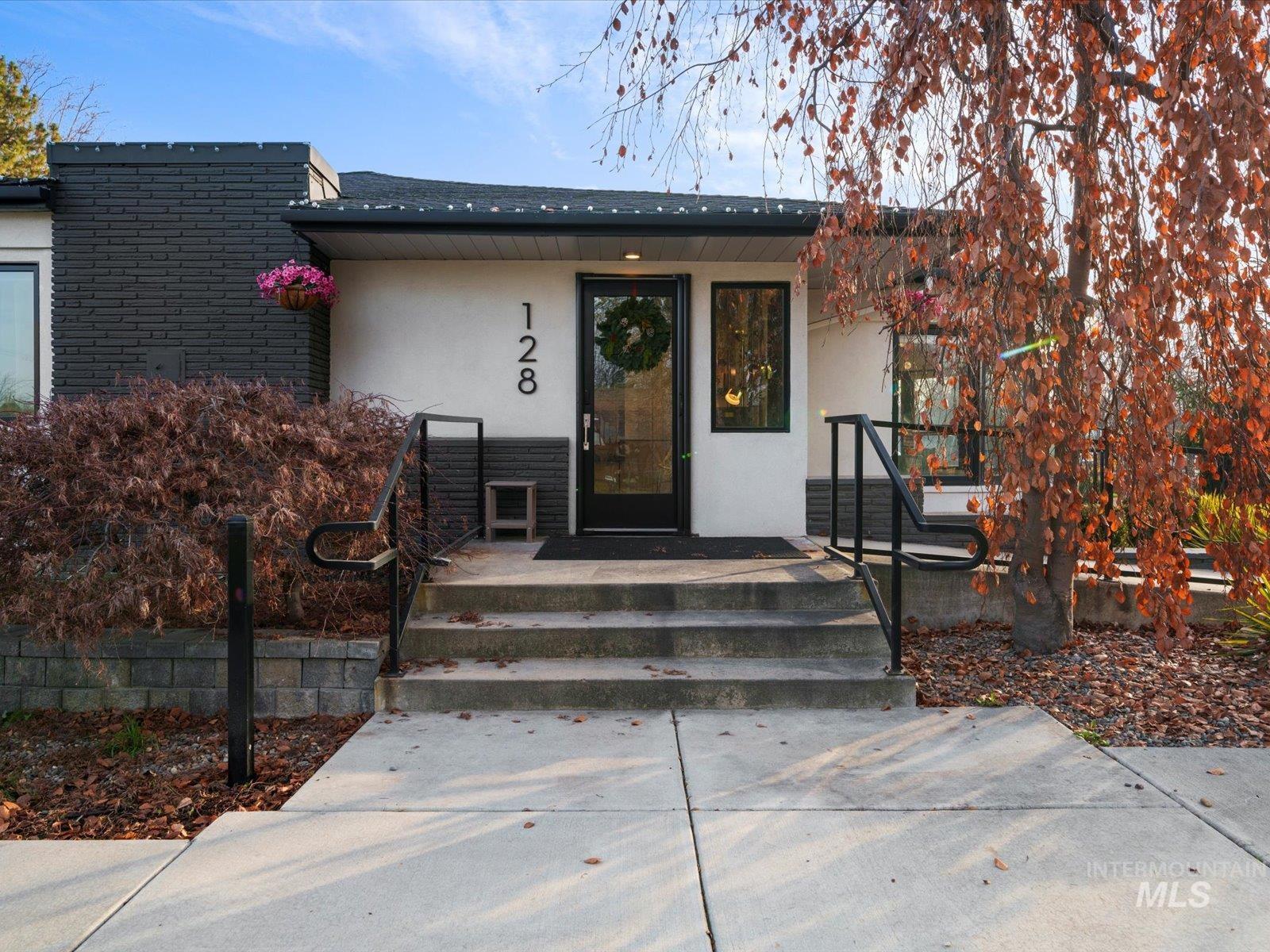 Property entrance featuring stucco siding