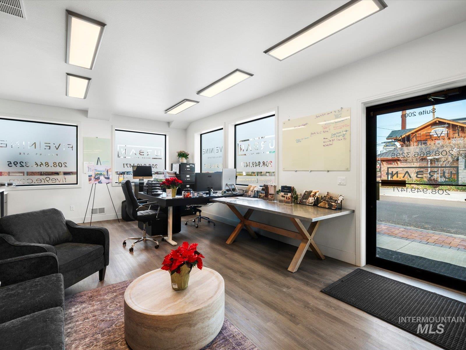 Office featuring wood finished floors and plenty of natural light