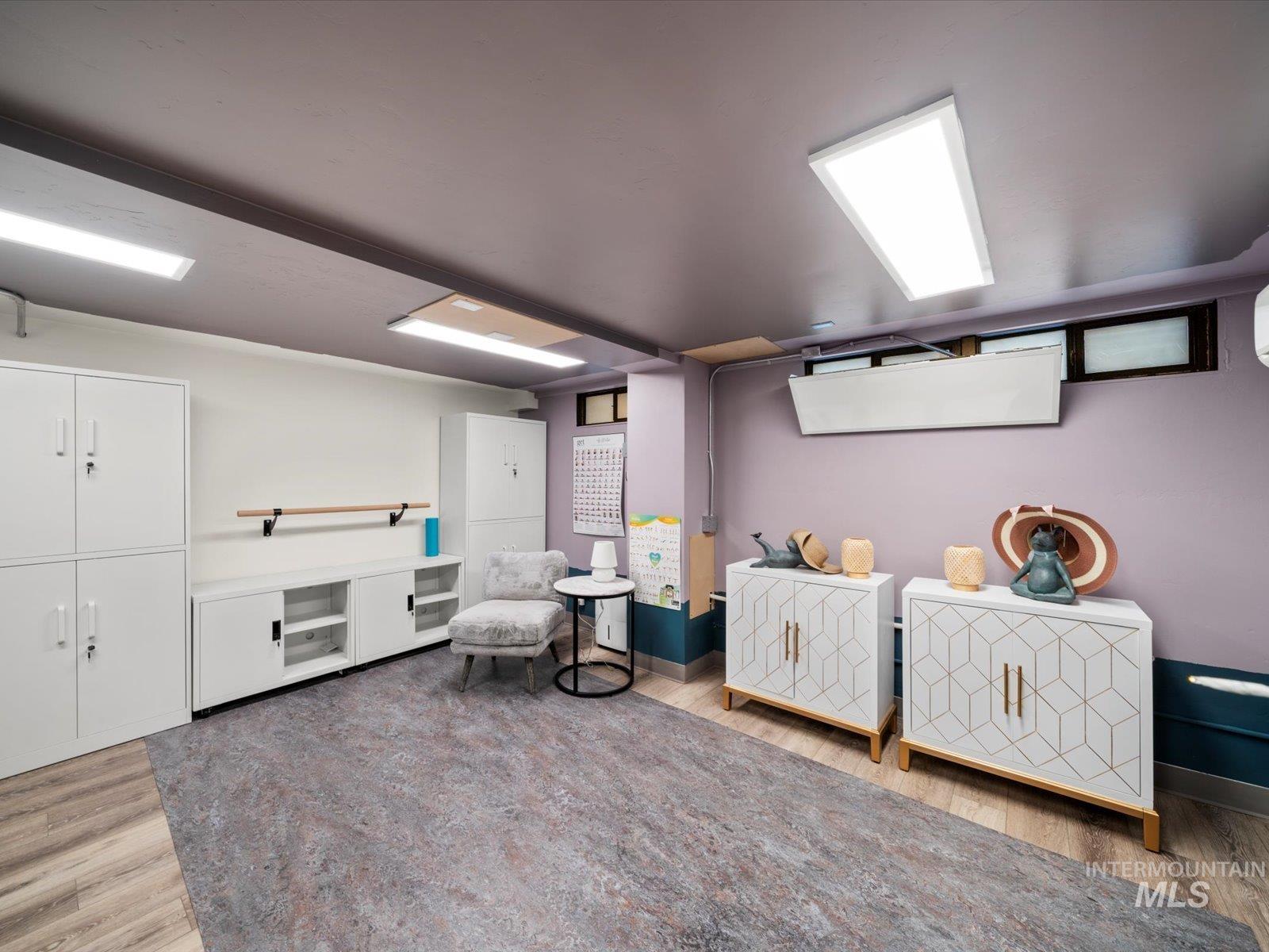 Sitting room featuring light wood-type flooring