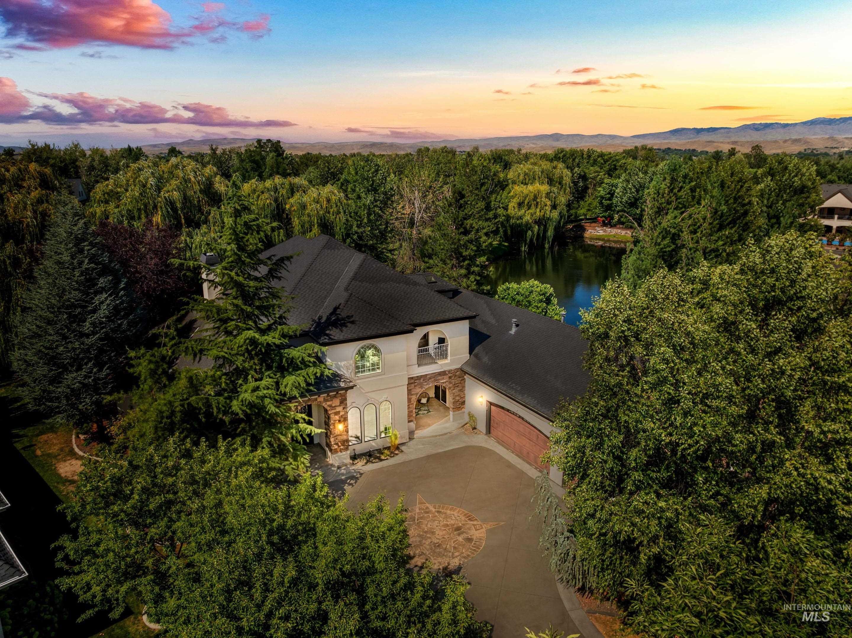 View from above of property with a nearby body of water