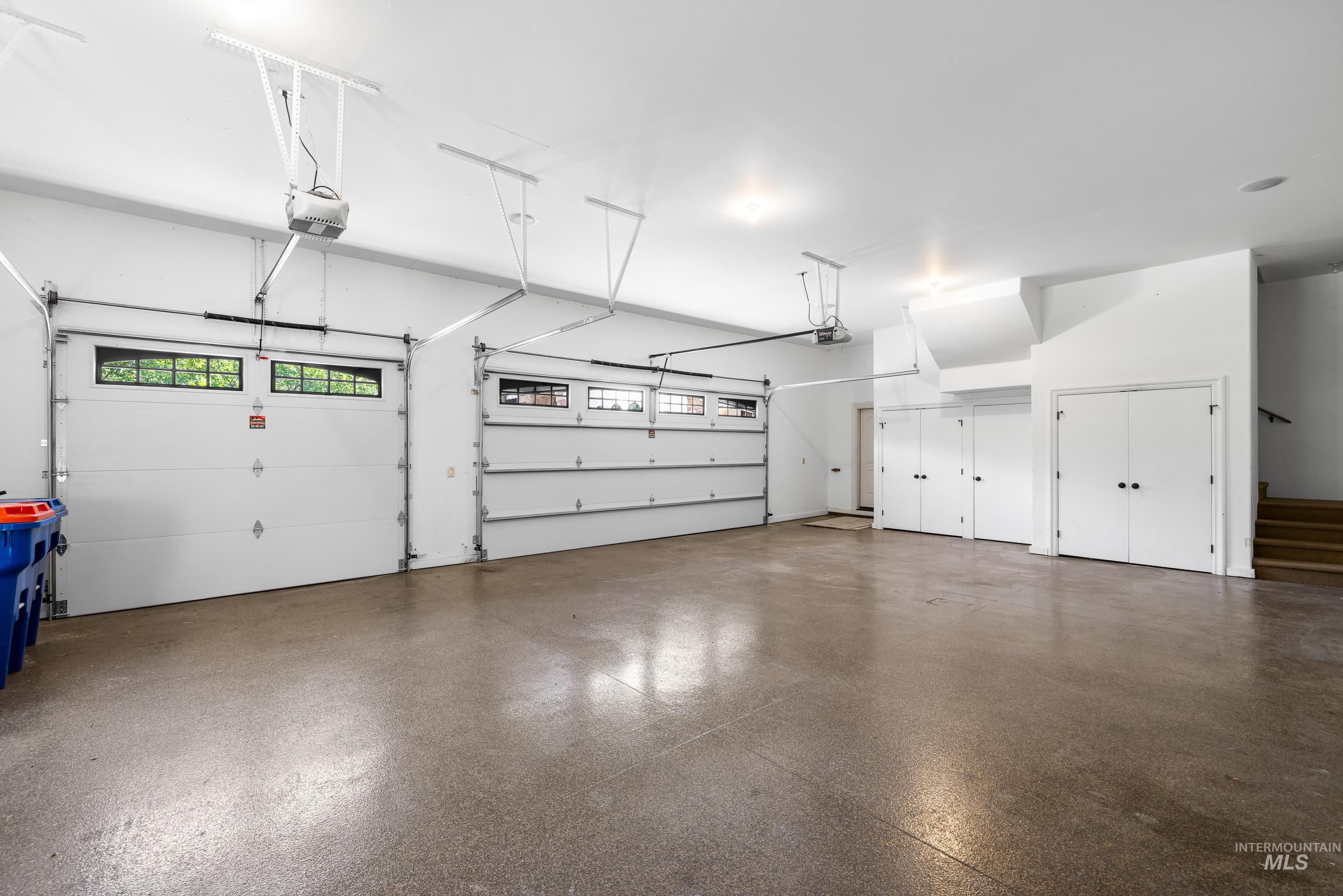 Garage featuring a garage door opener