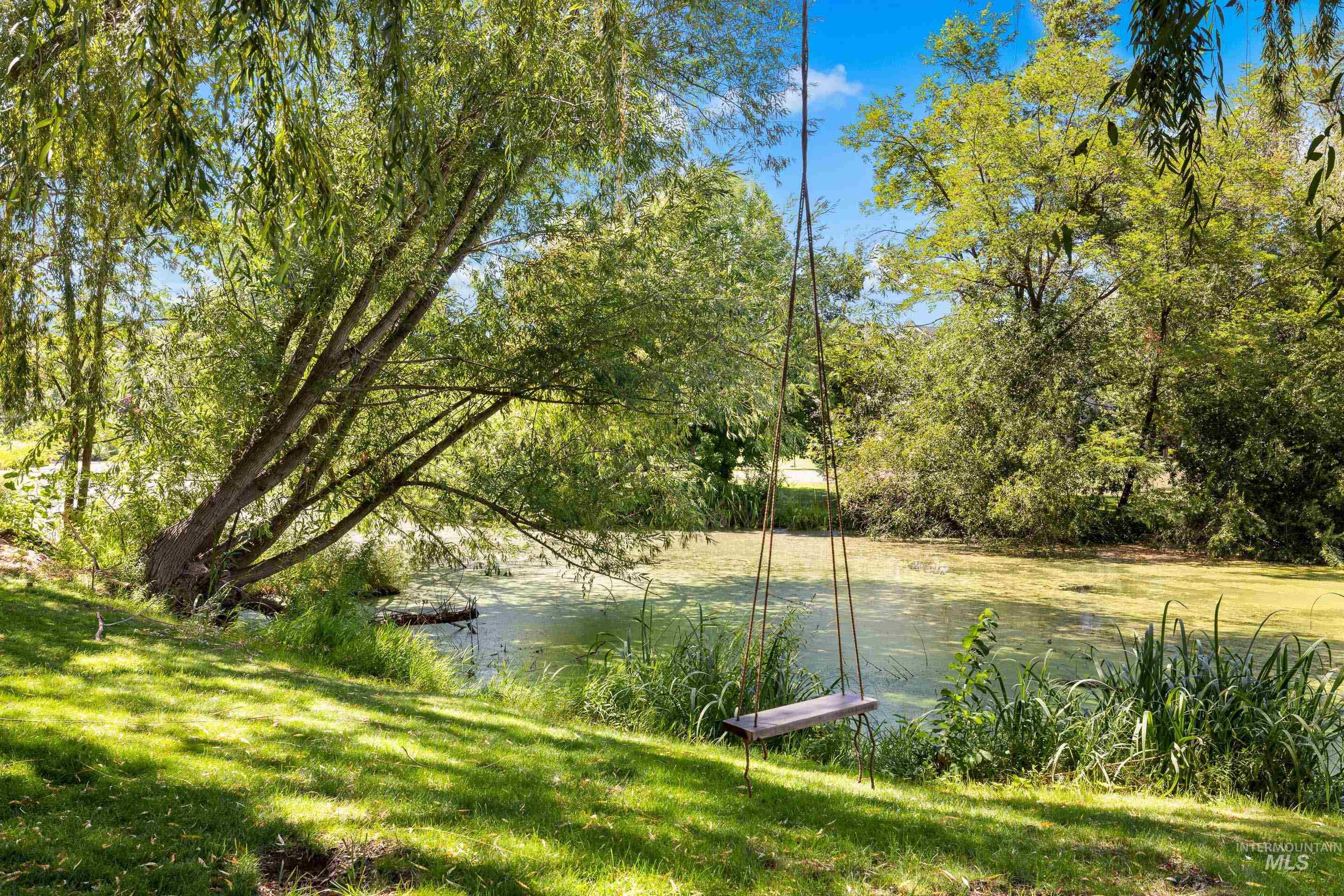 View of yard with a water view