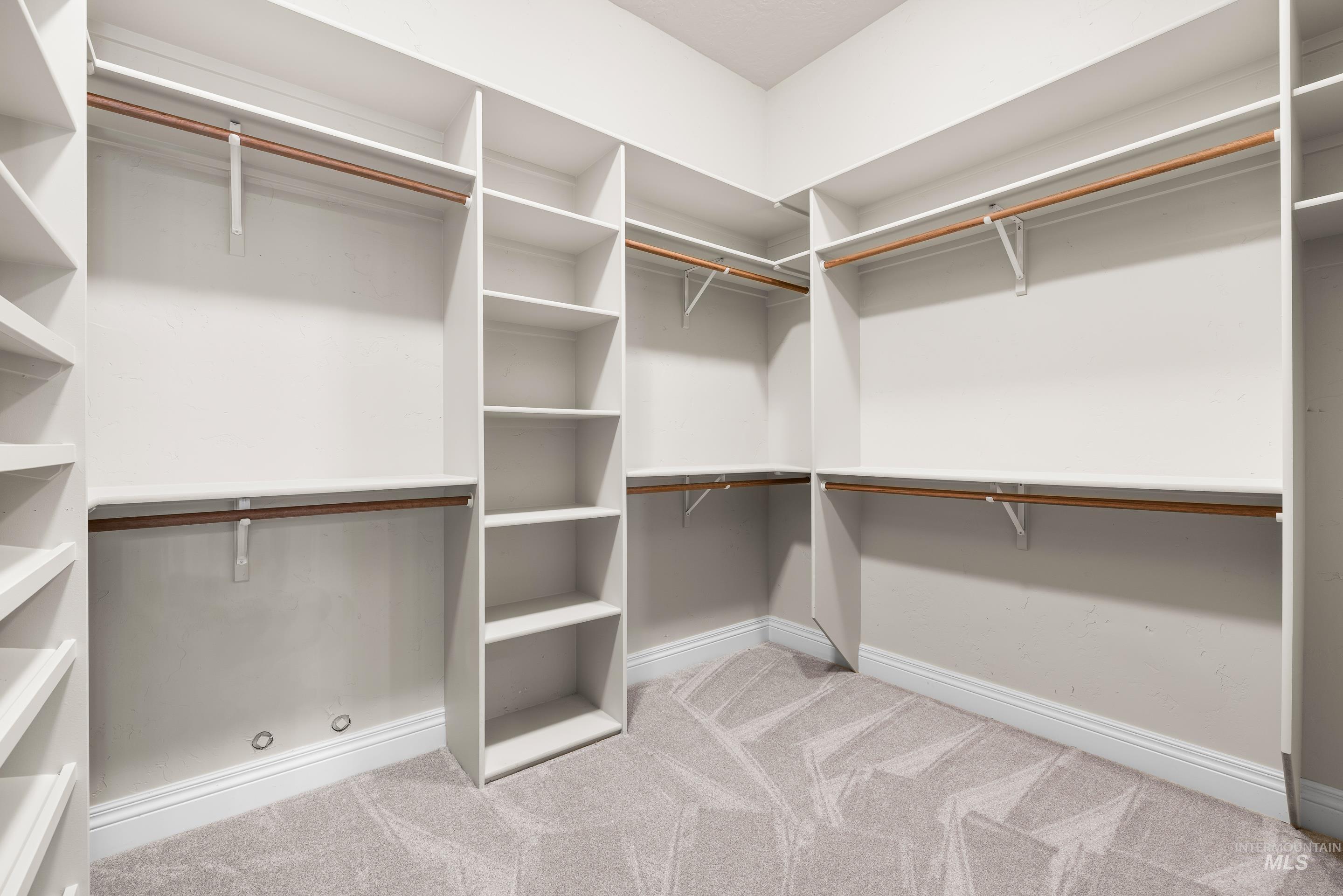 Spacious closet with carpet floors