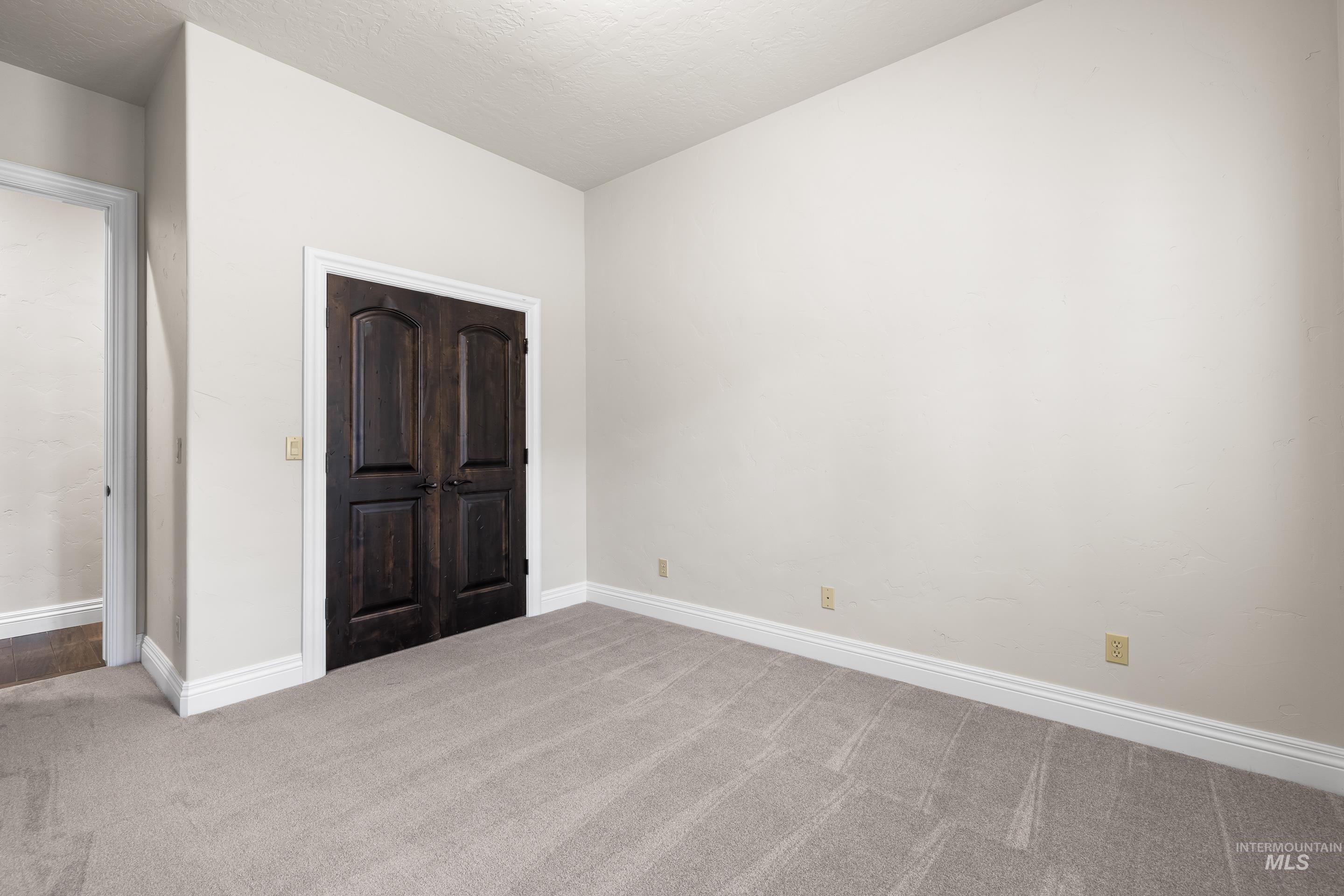 Unfurnished bedroom featuring carpet flooring