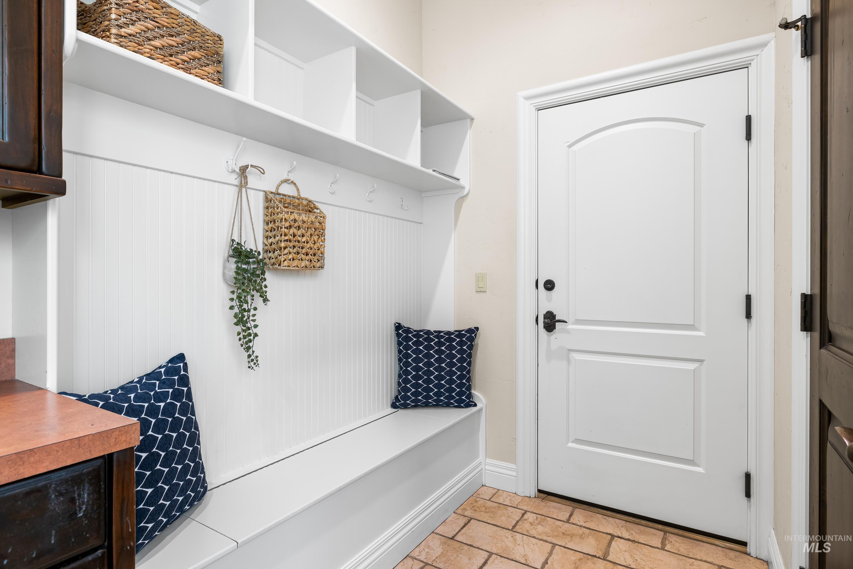 Mudroom featuring baseboards