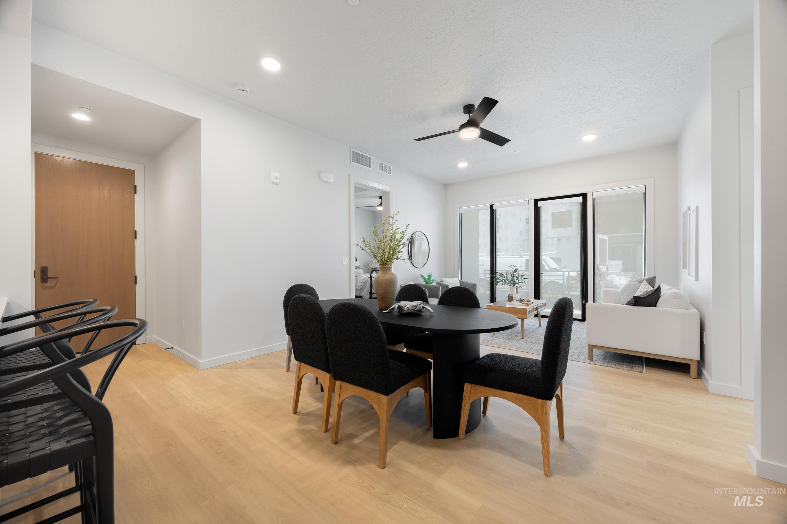 Dining room featuring light wood-style floors, recessed lighting, and a ceiling fan