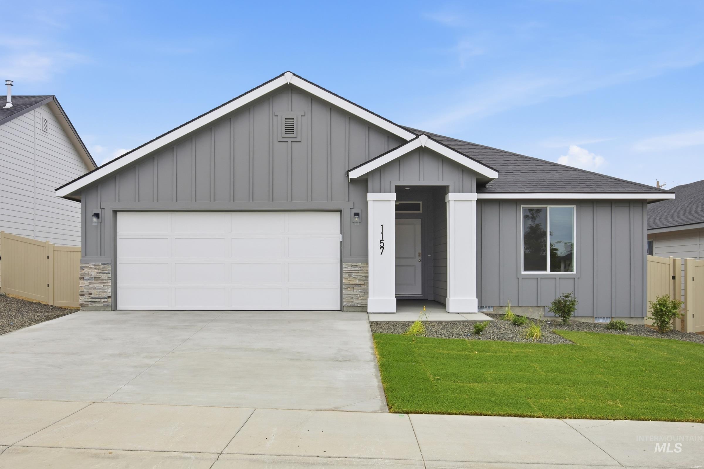 Contemporary ranch-style residence featuring vertical board and batten siding