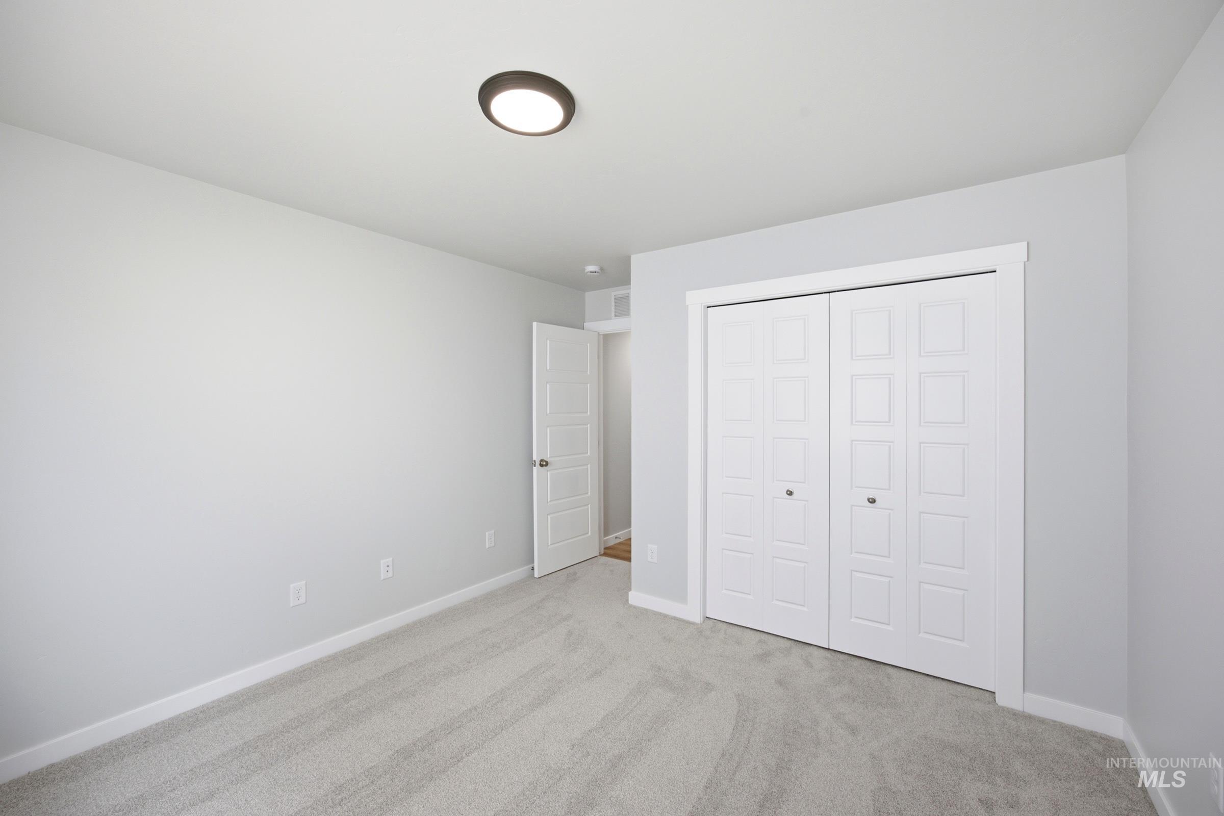 Light gray carpeting and walls create a neutral palette