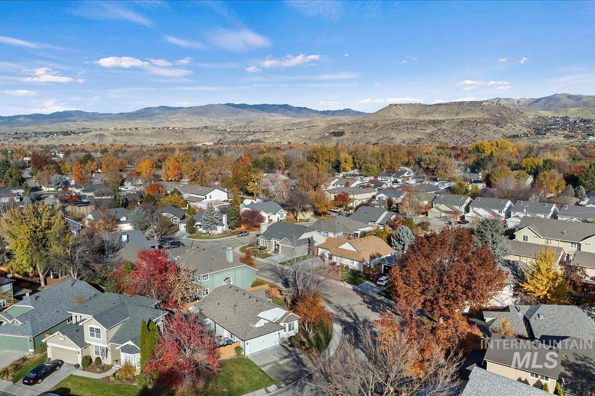 Aerial perspective of suburban area with a mountain backdrop