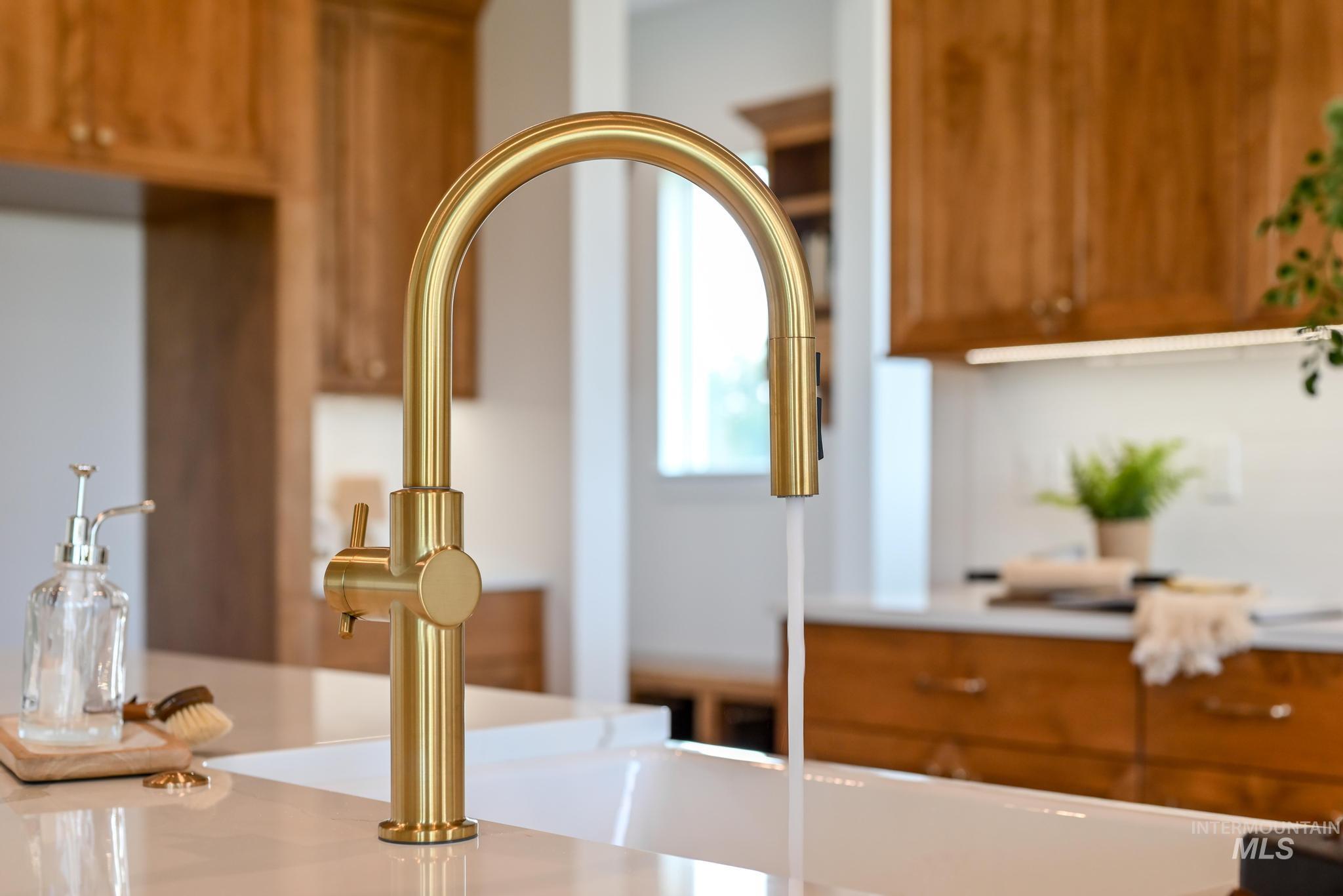 Kitchen view of brown cabinetry and light countertops