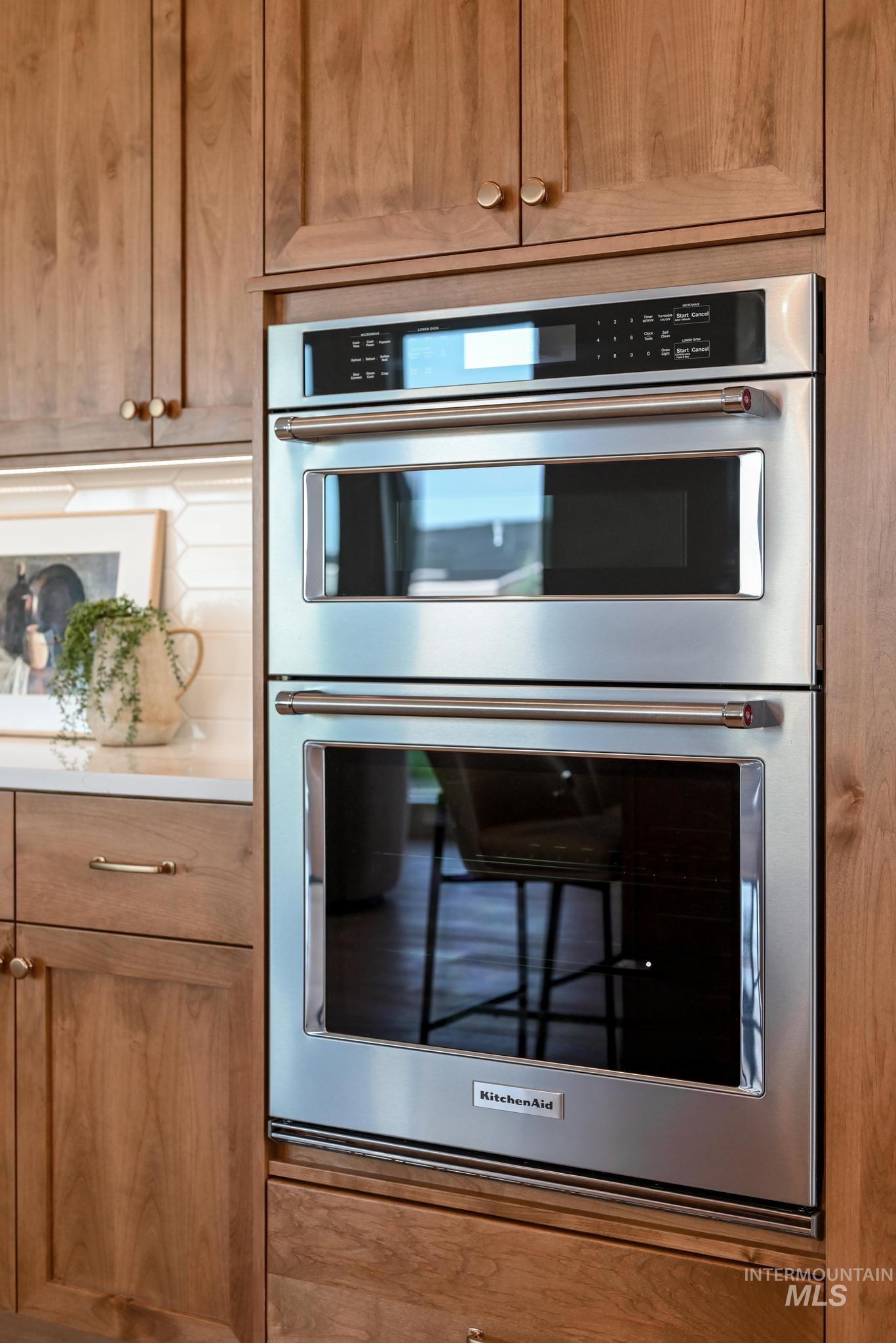 Kitchen with double oven and brown cabinets