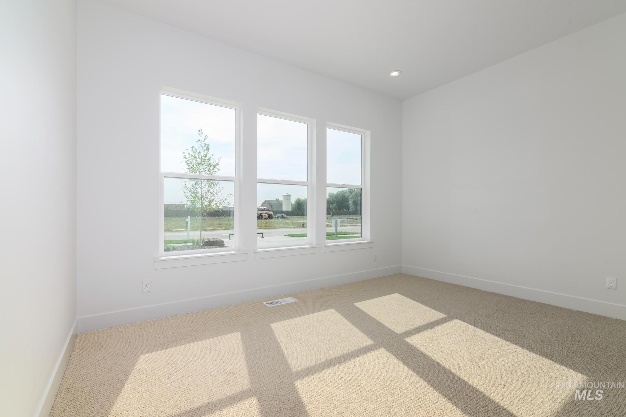 Empty room featuring carpet and recessed lighting