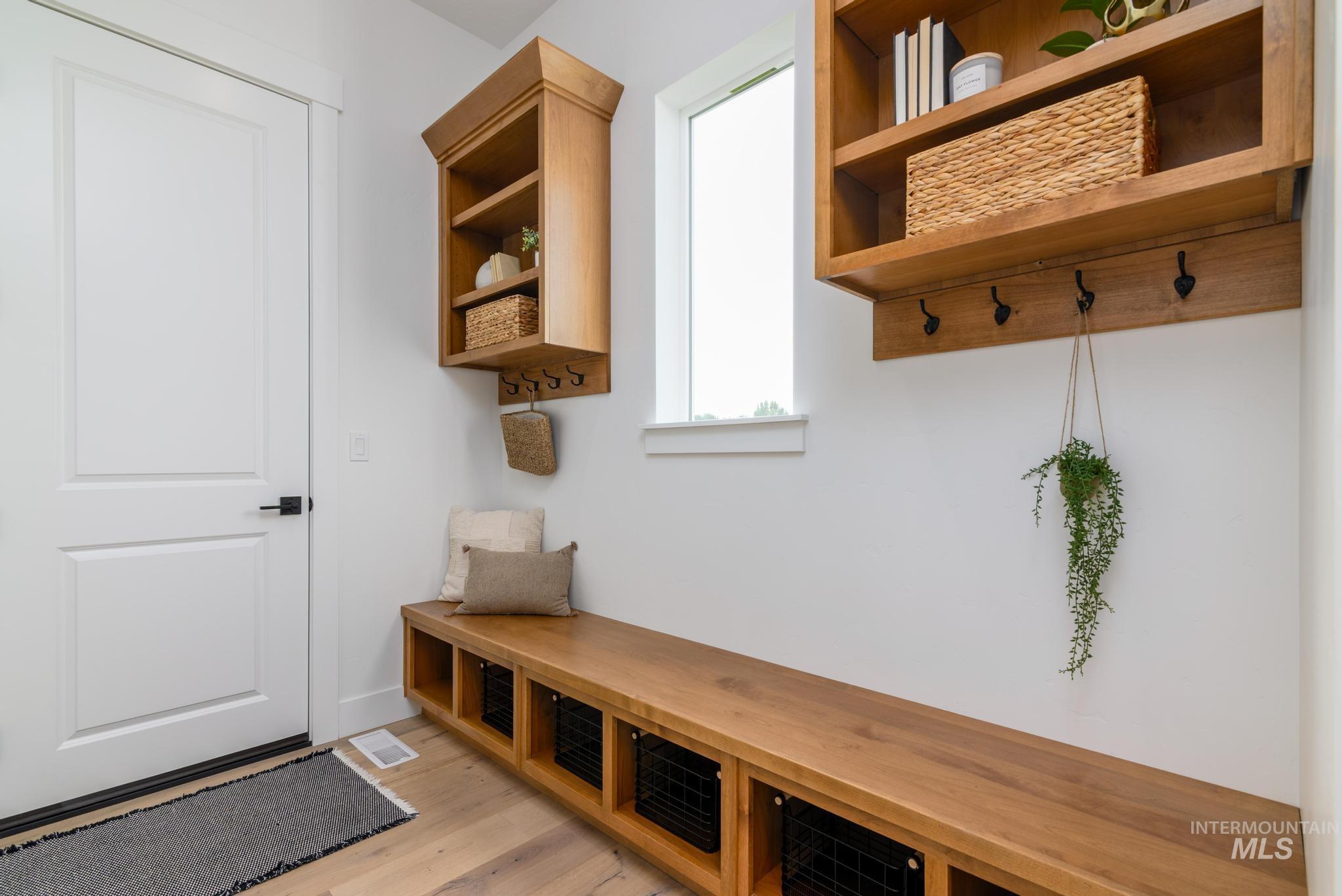 Mudroom featuring light wood finished floors