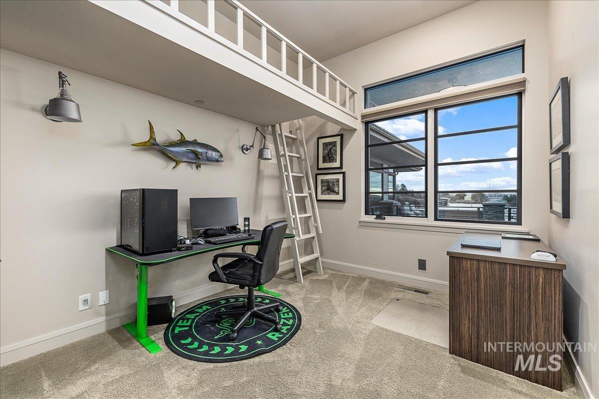 Carpeted home office with baseboards