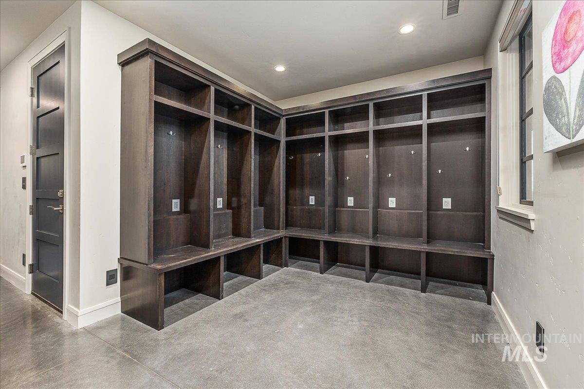 Mudroom featuring concrete floors and recessed lighting