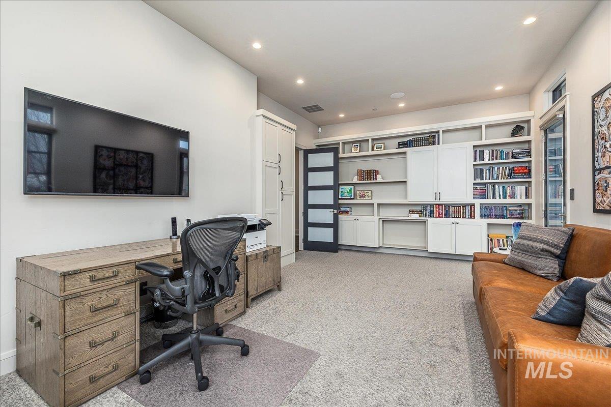 Office featuring light carpet and recessed lighting