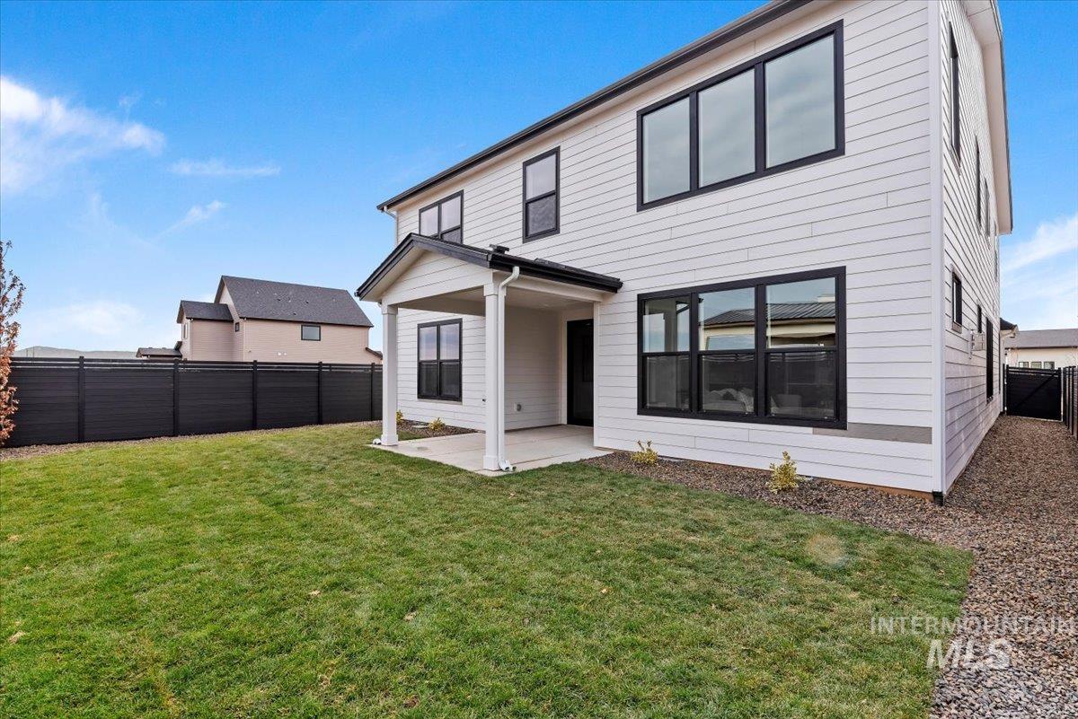 Back of house featuring a patio area and a fenced backyard