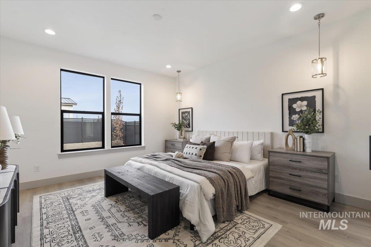 Bedroom featuring light wood-type flooring and recessed lighting