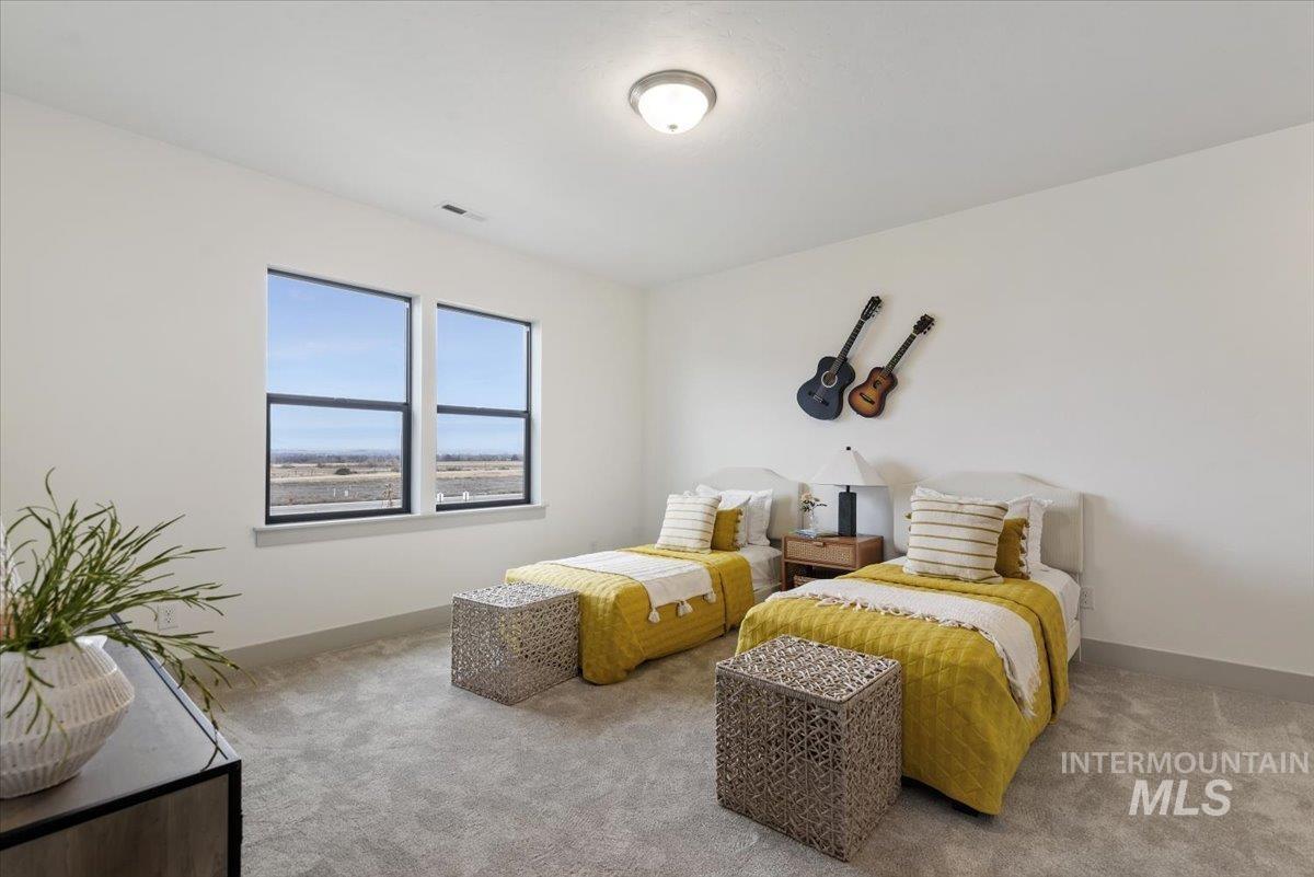 Carpeted bedroom with baseboards