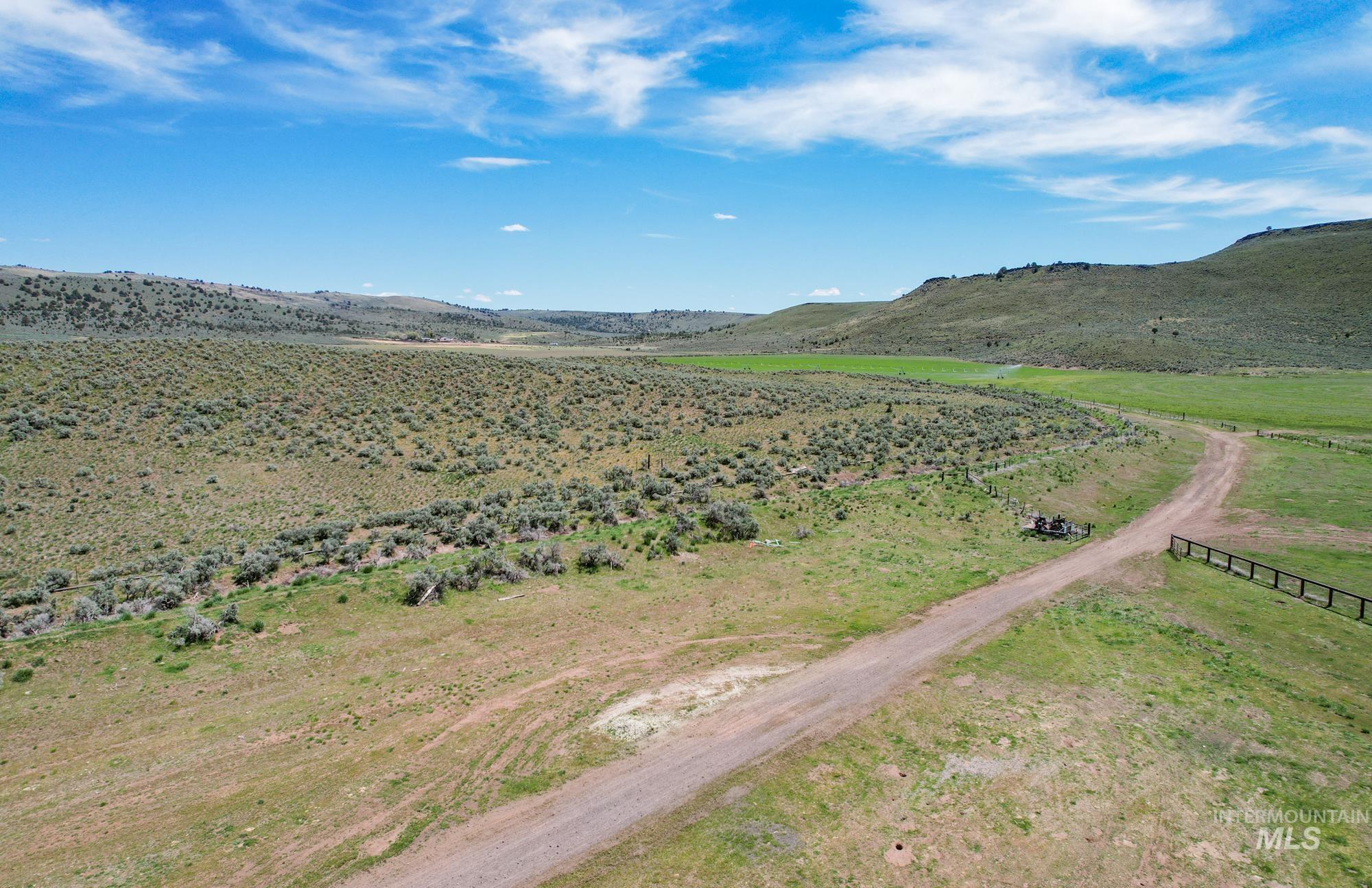 View of mountain background featuring rural landscape
