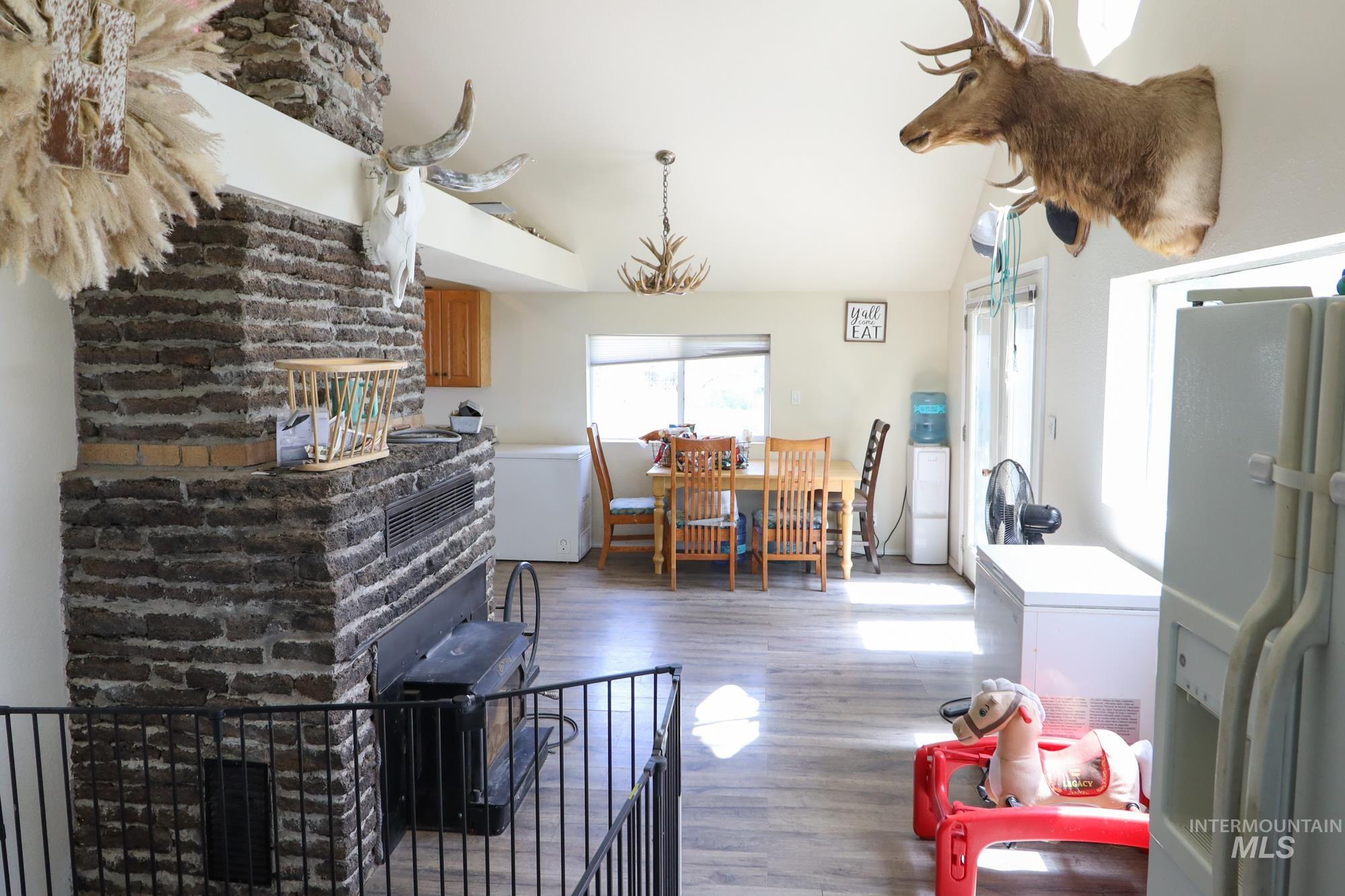Living room featuring wood finished floors and lofted ceiling