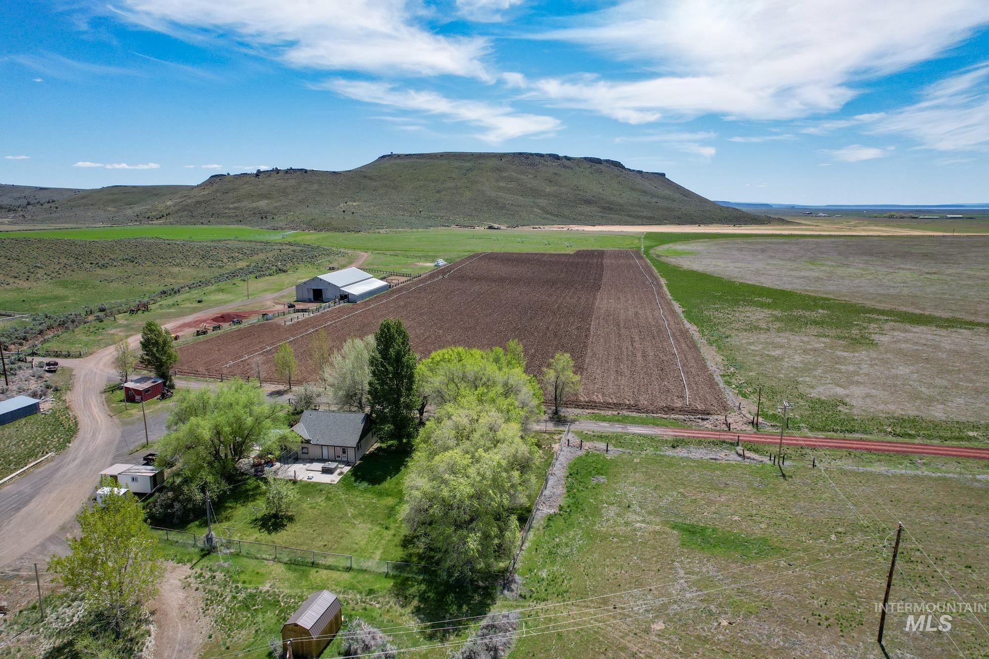 Aerial view of sparsely populated area featuring a mountain backdrop