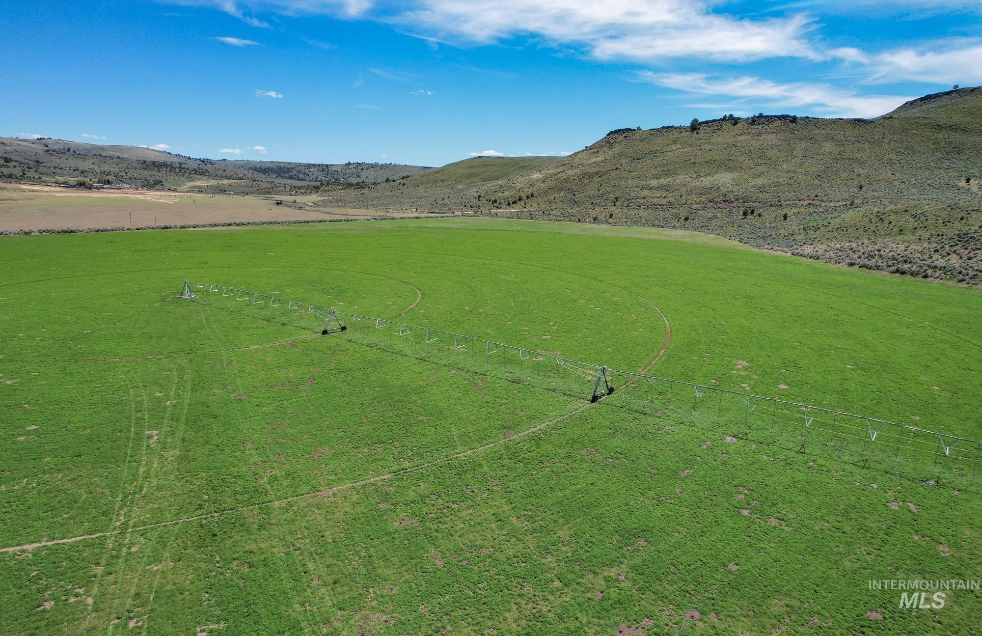 View of mountain backdrop featuring rural landscape